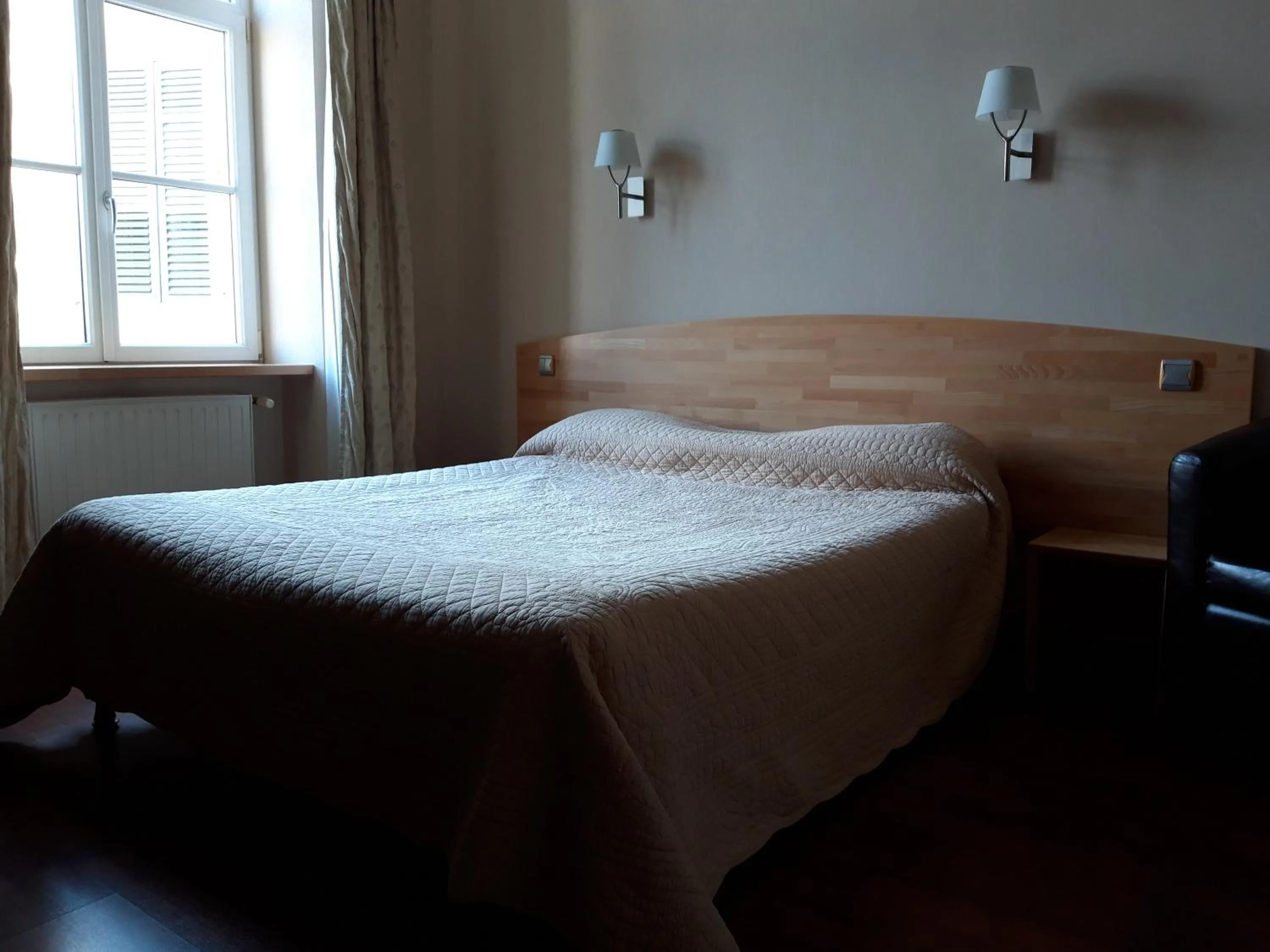 Bed in Hôtel la Guimbarde