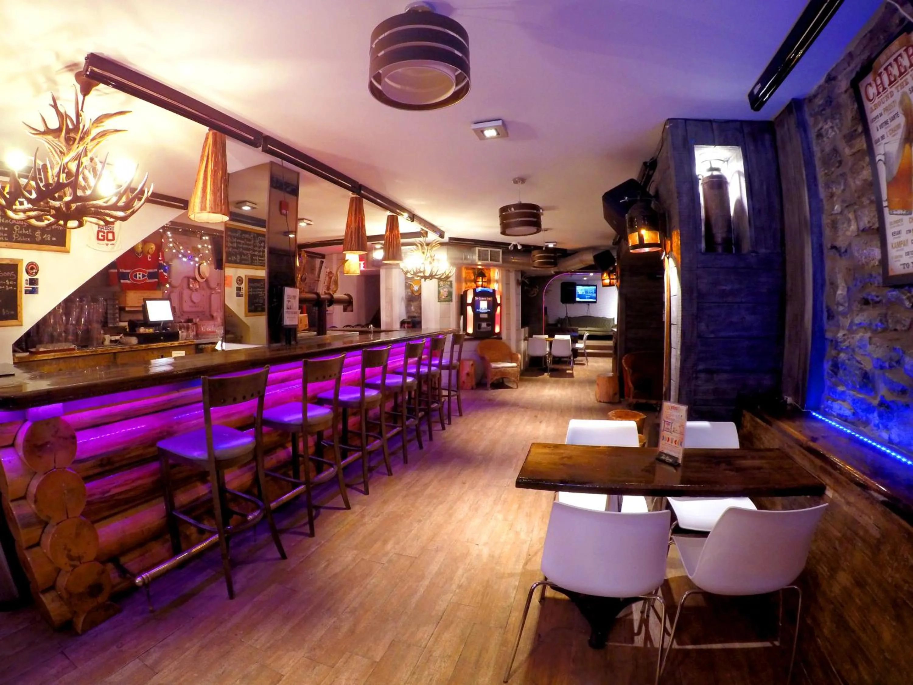 Communal lounge/ TV room in M Montreal Hostel