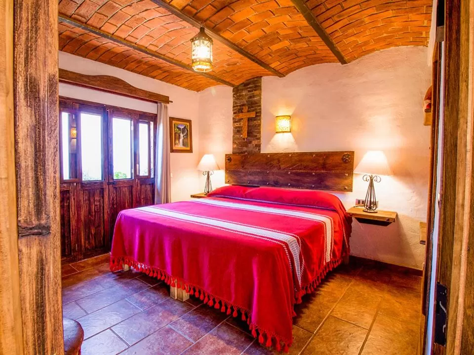 Photo of the whole room, Bed in Hotel Mi Pueblito Tapalpa