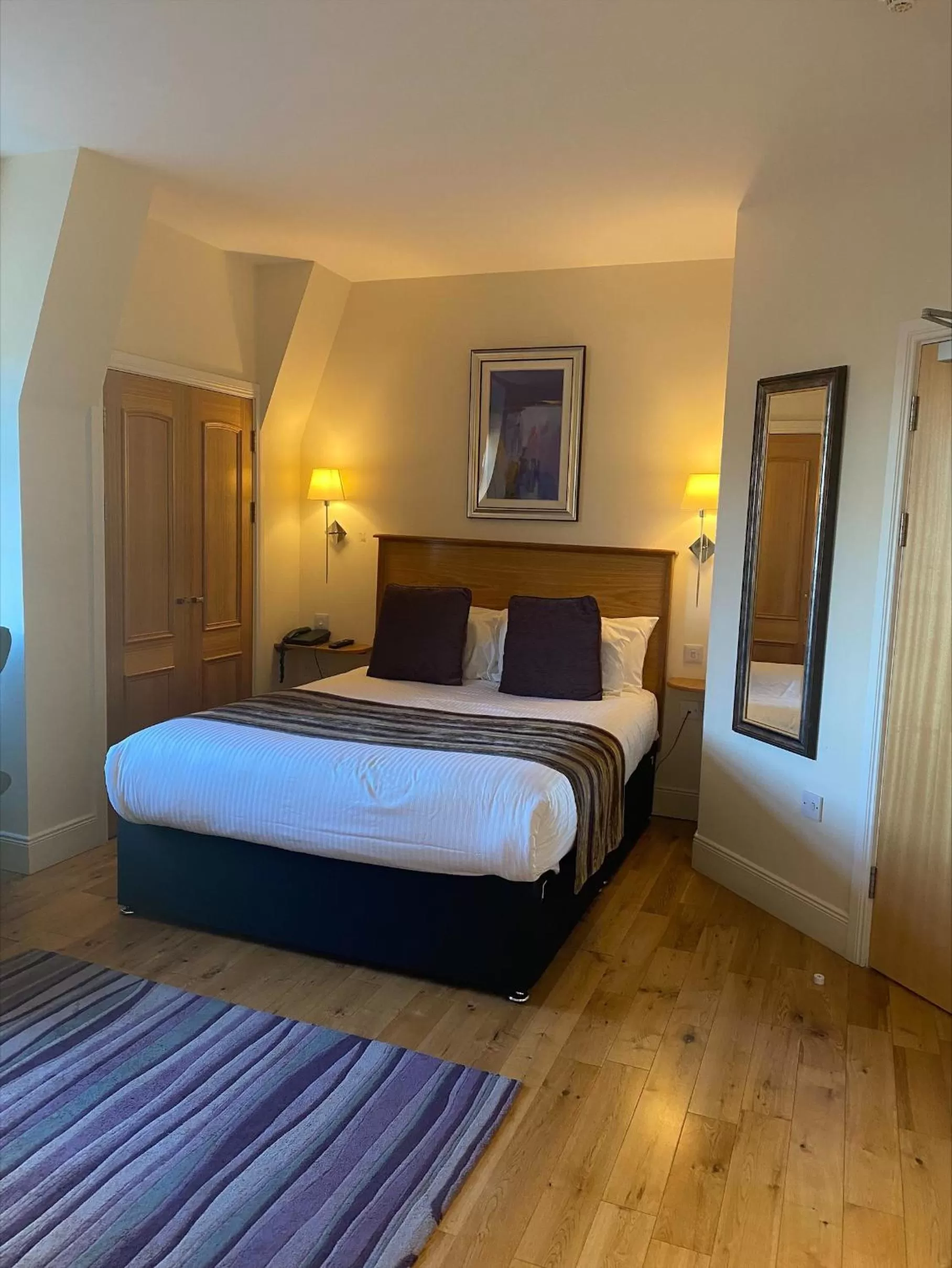 Bed in Royal Athenaeum Suites