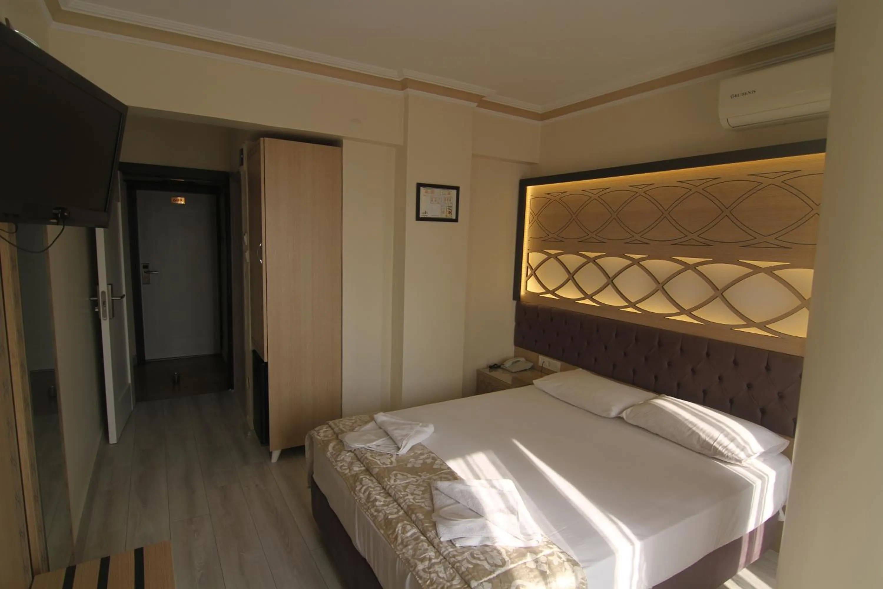 Bed in Grand Liza Hotel