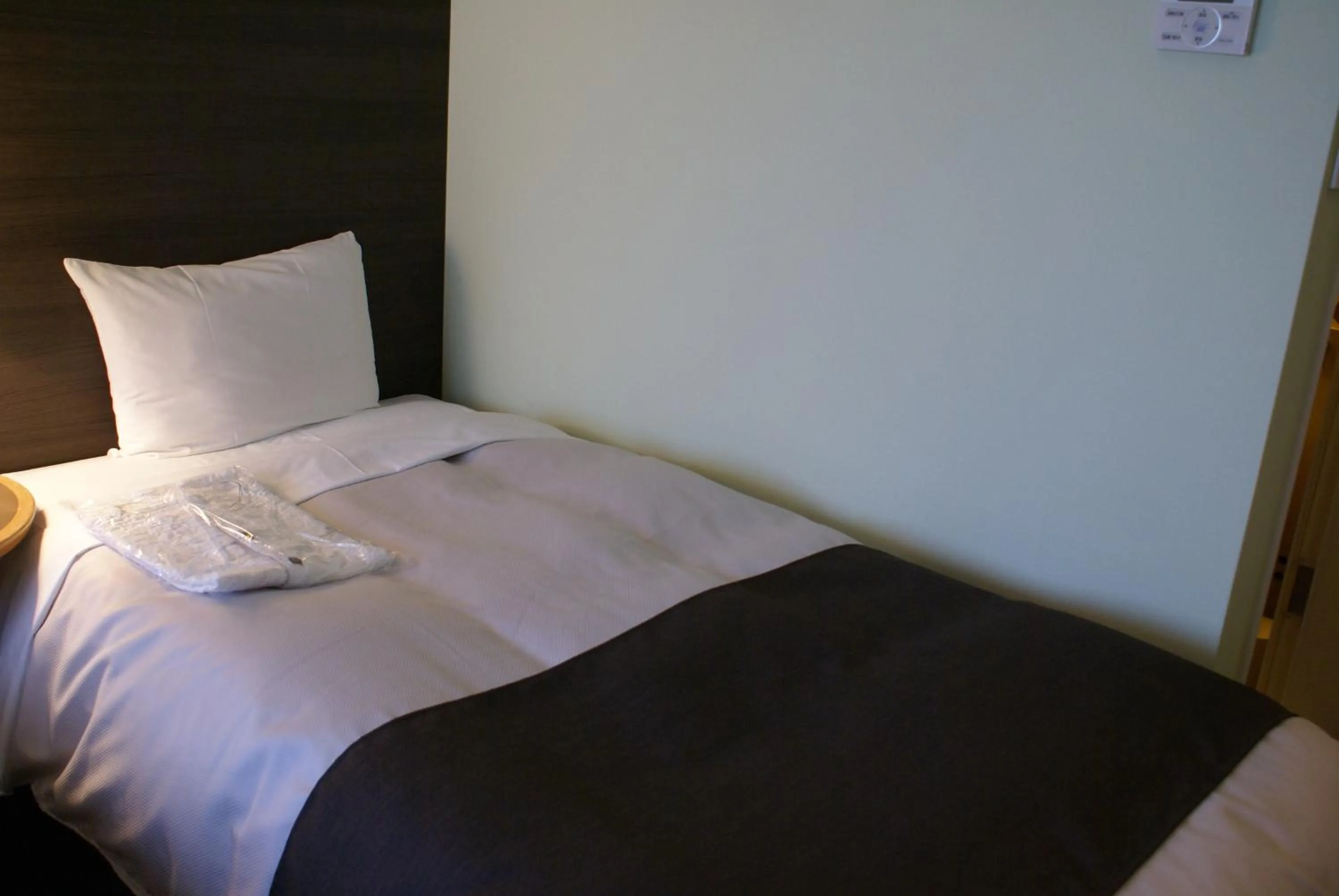 Bed in Ginza Grand Hotel