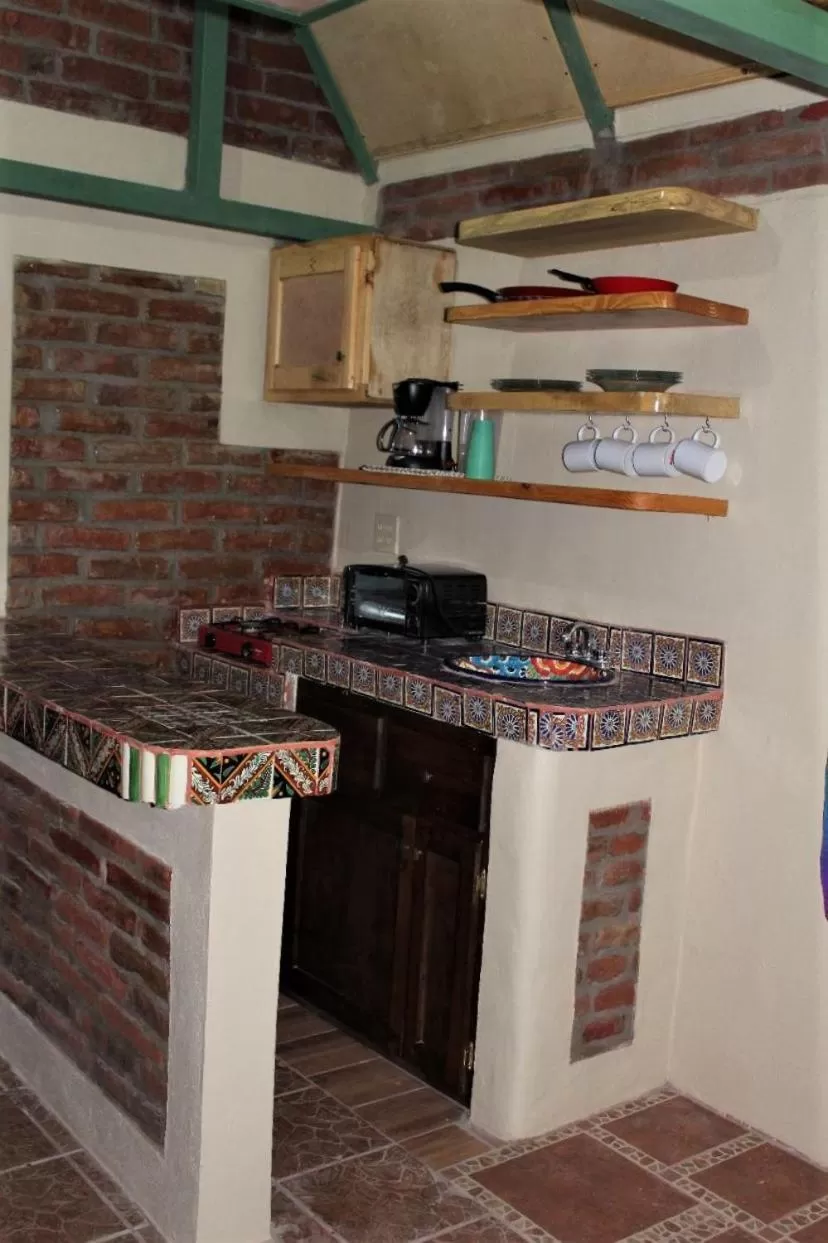 Kitchen or kitchenette in Cabañas Rústicas El Benny by Rotamundos