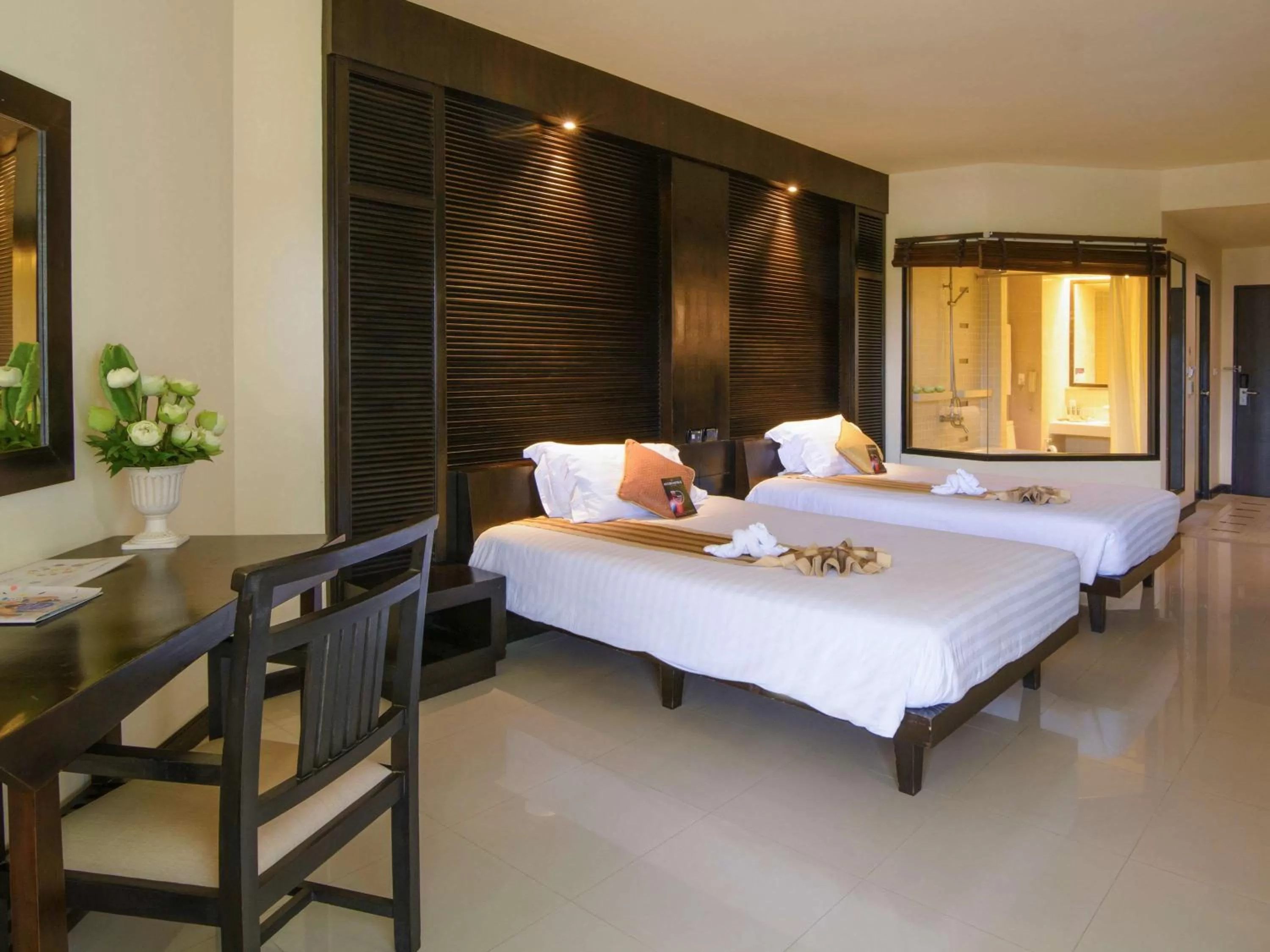 Photo of the whole room, Bed in The Nouveau Chumphon Beach Resort And Golf
