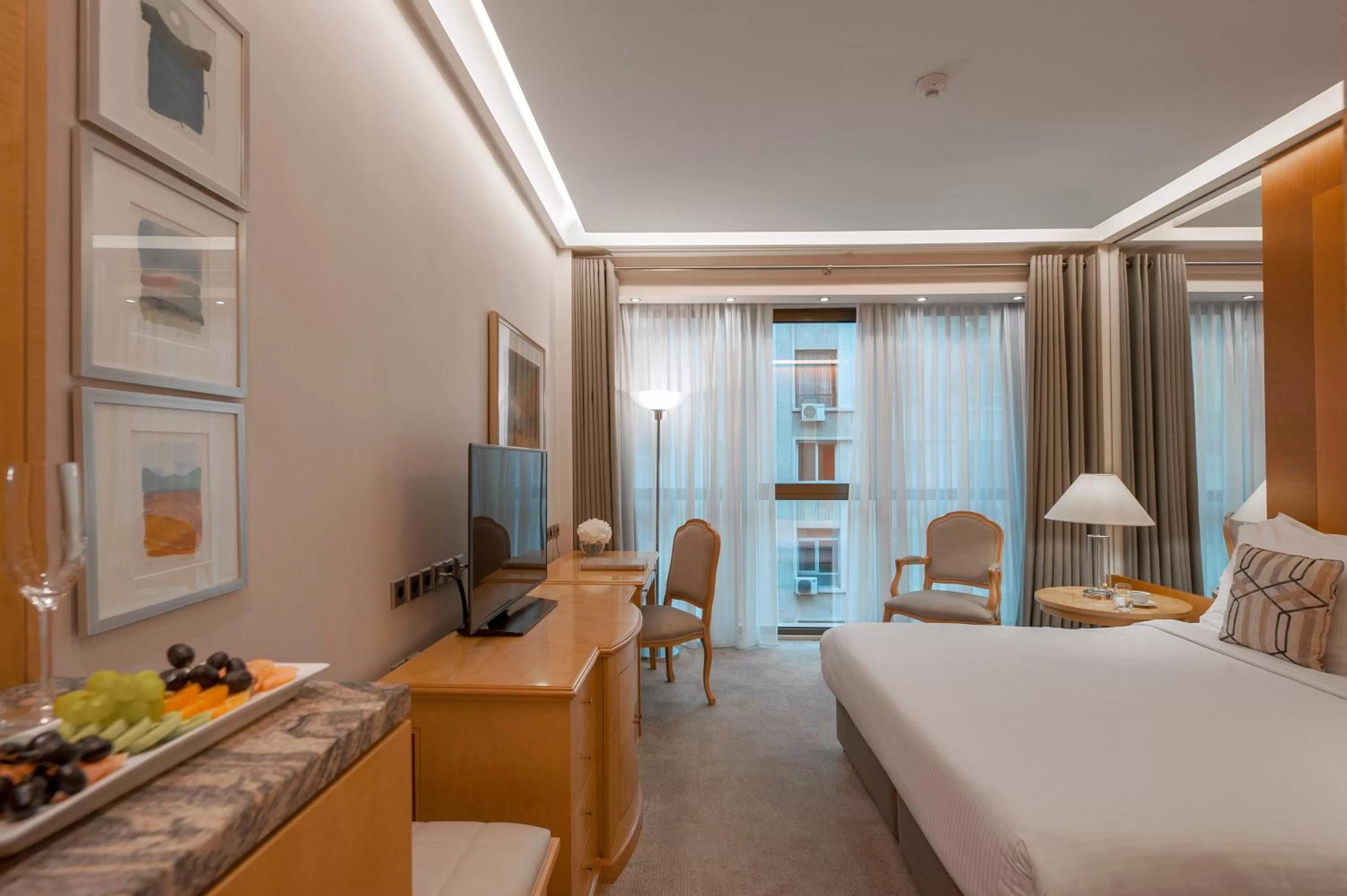 Seating area, Bed in Melia Athens
