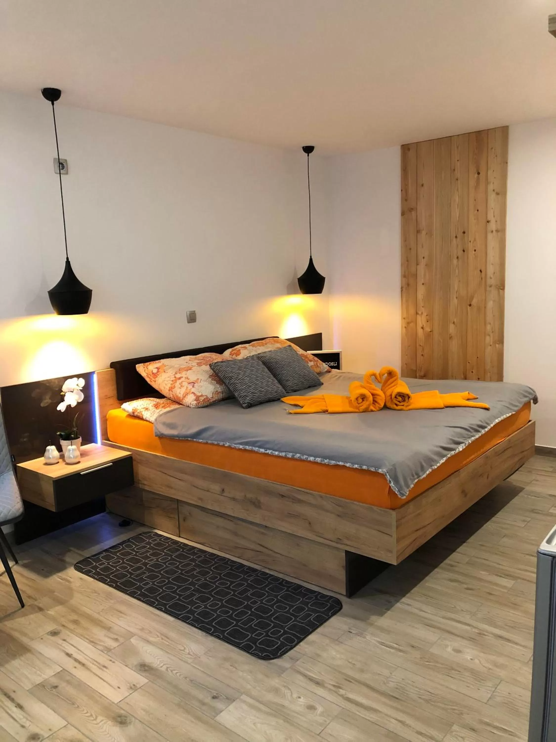 Bed in Korošec Apartments and Wellness Centre