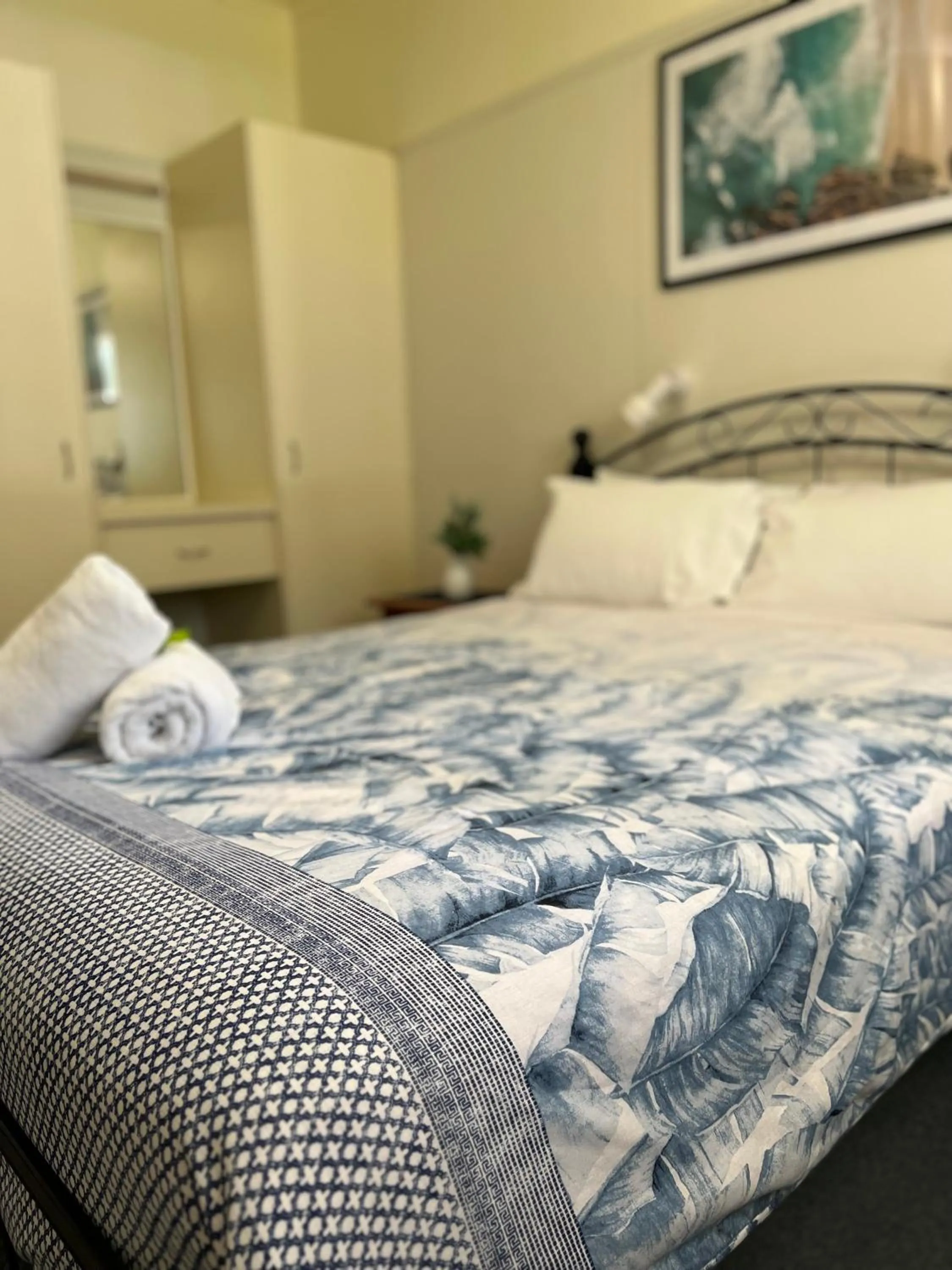 Bed in Colonial Village Resort