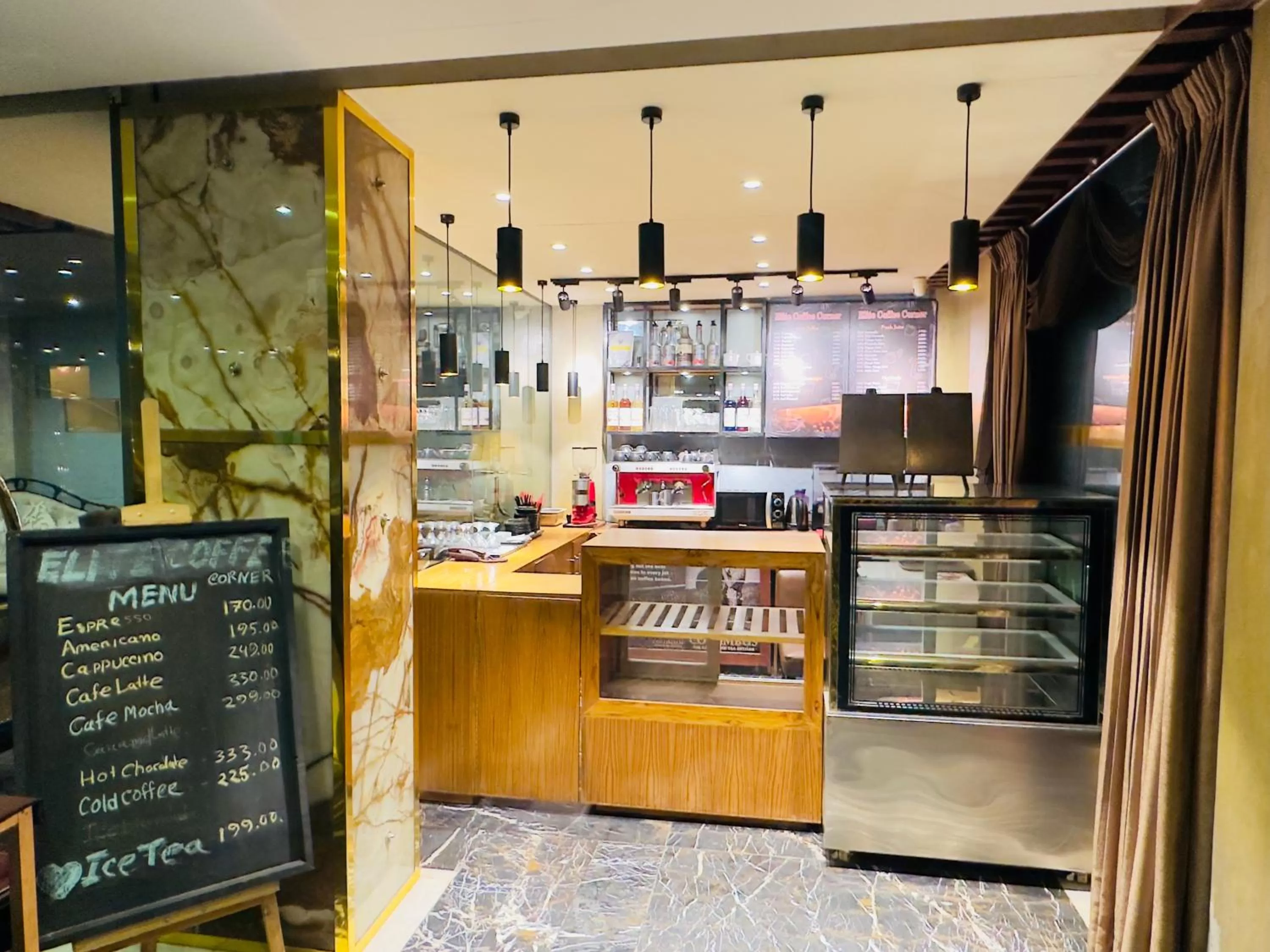 Coffee/tea facilities in The Elite Residence Dhaka