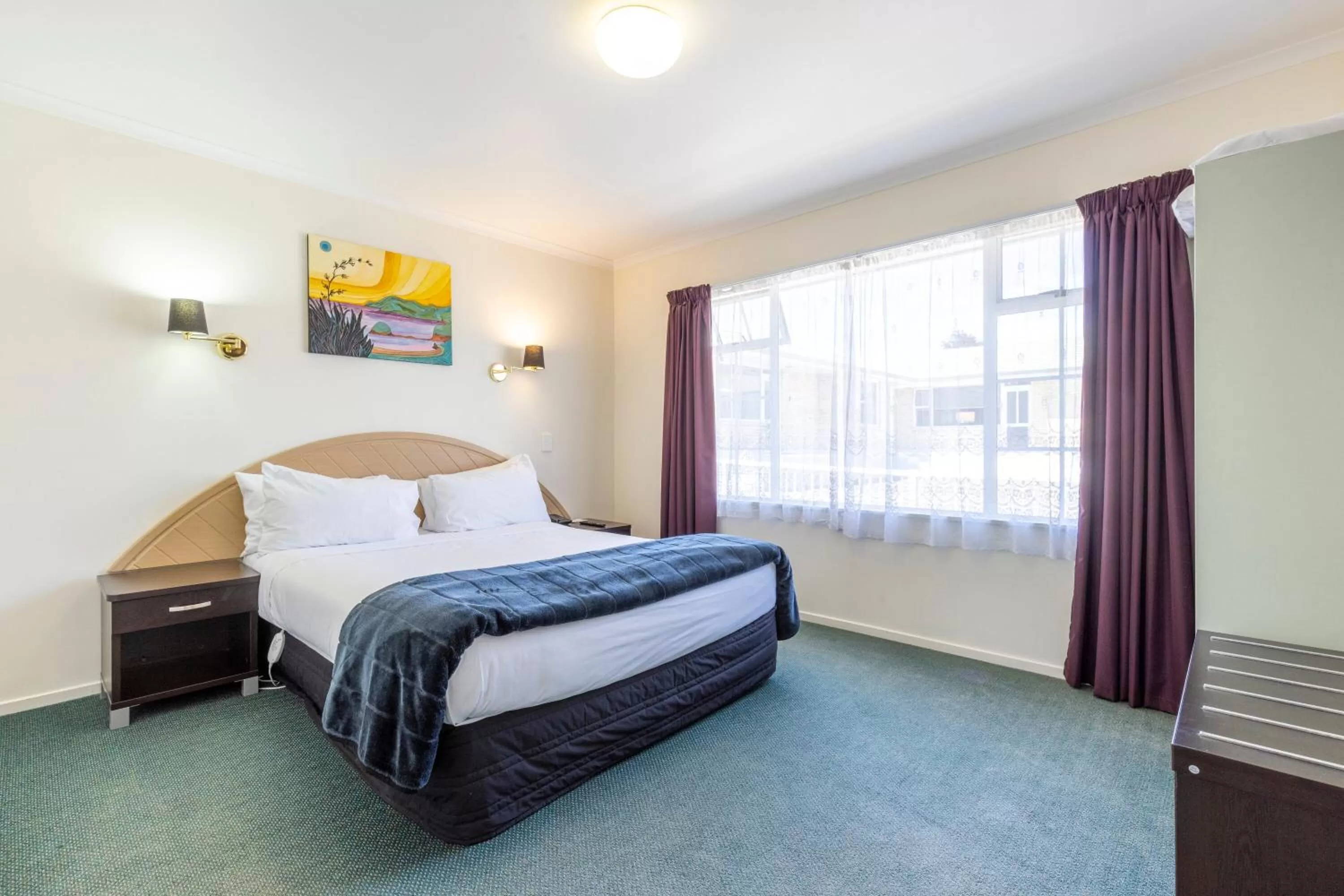 Bed in ASURE PRINCE motor lodge