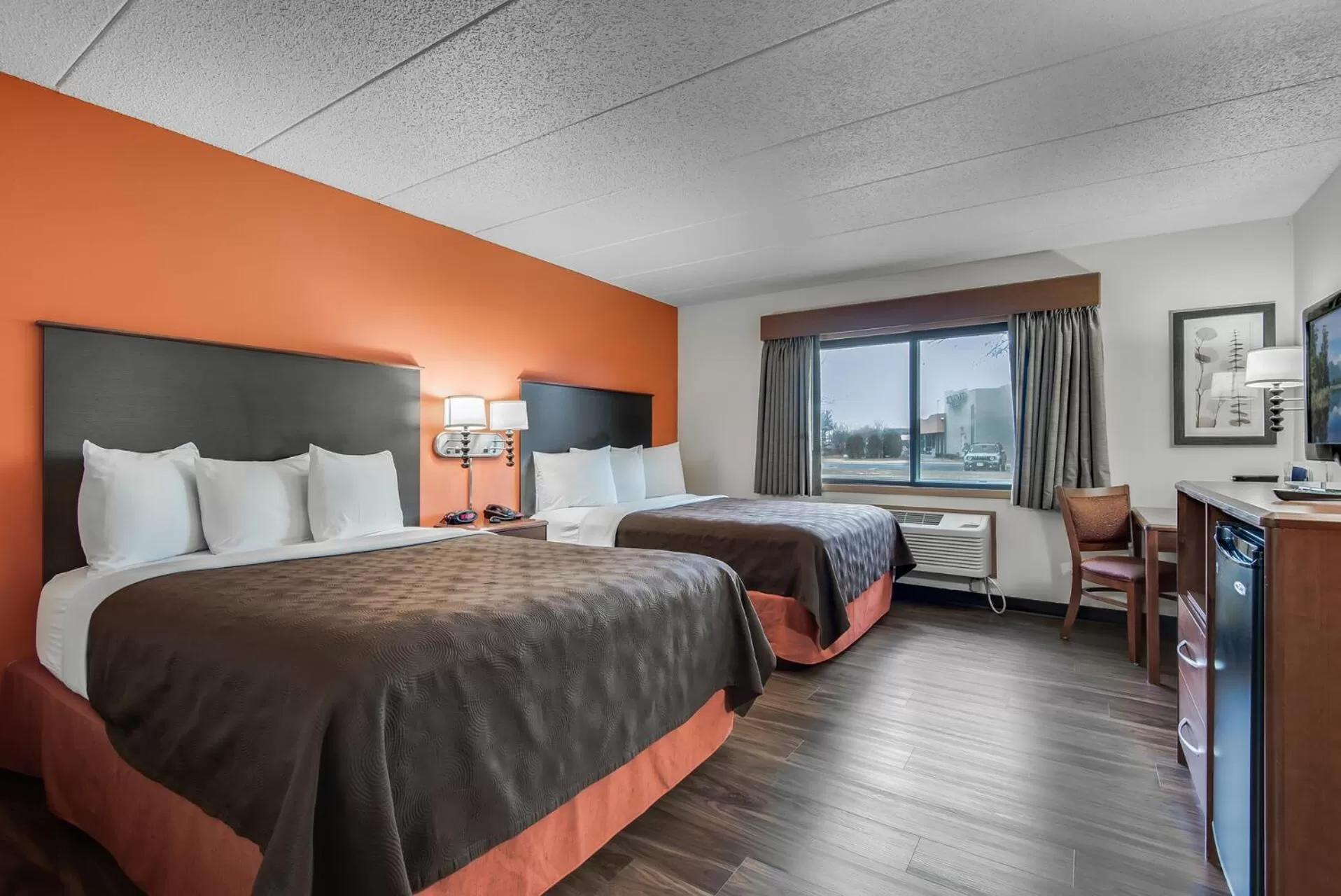 Bed in AmericInn by Wyndham Coon Rapids