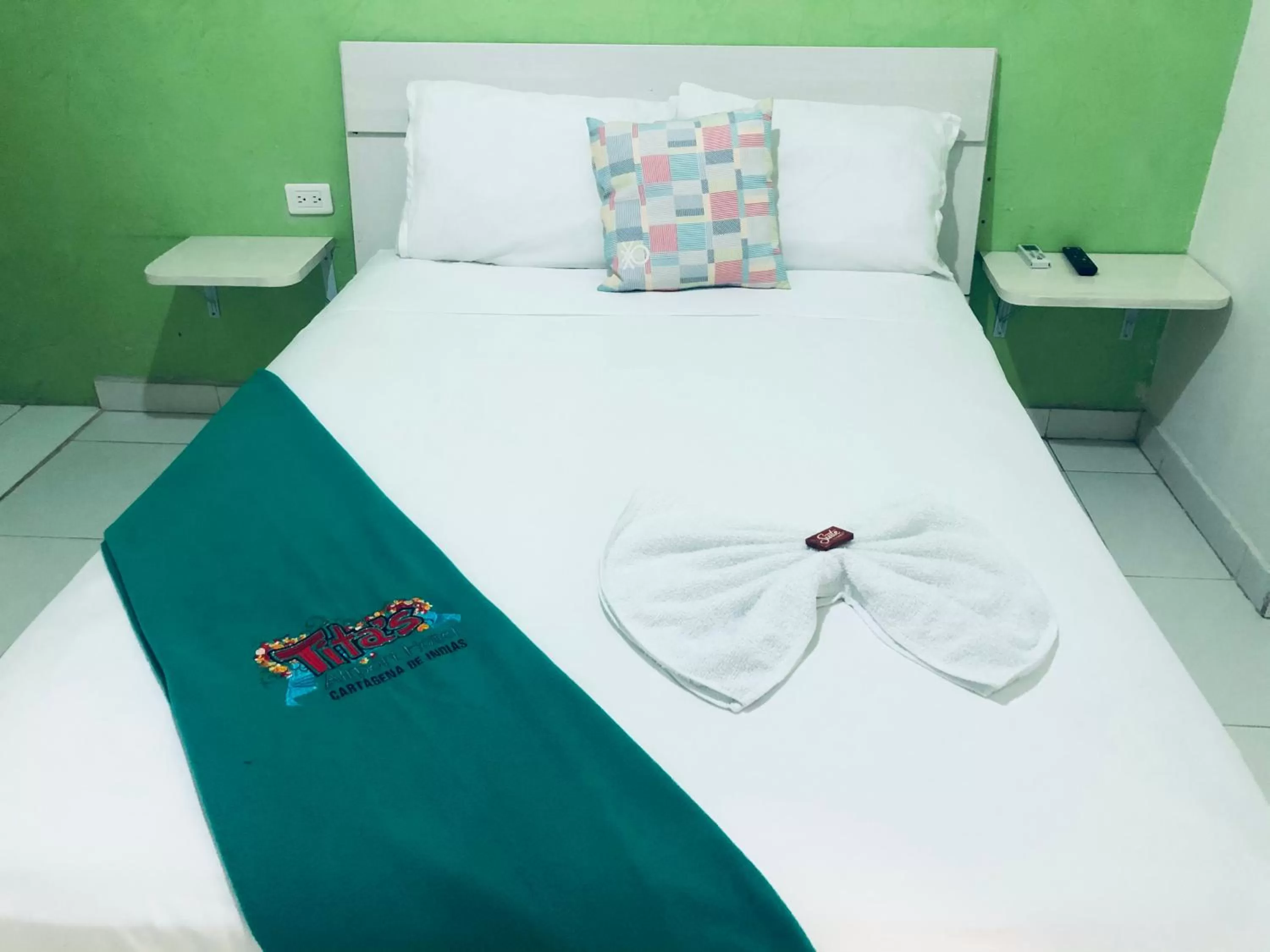 Bed in Tita’s Airport Hotel