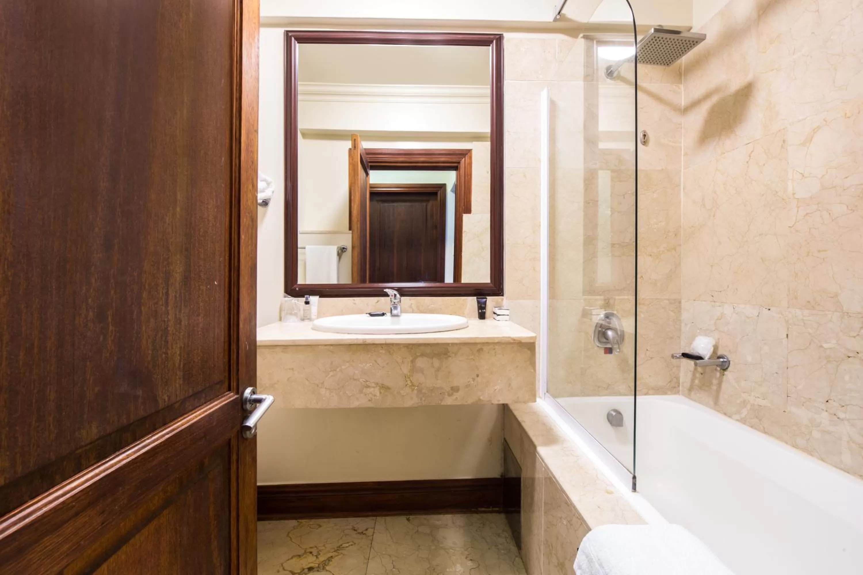 Bathroom in Belaire Suites Hotel