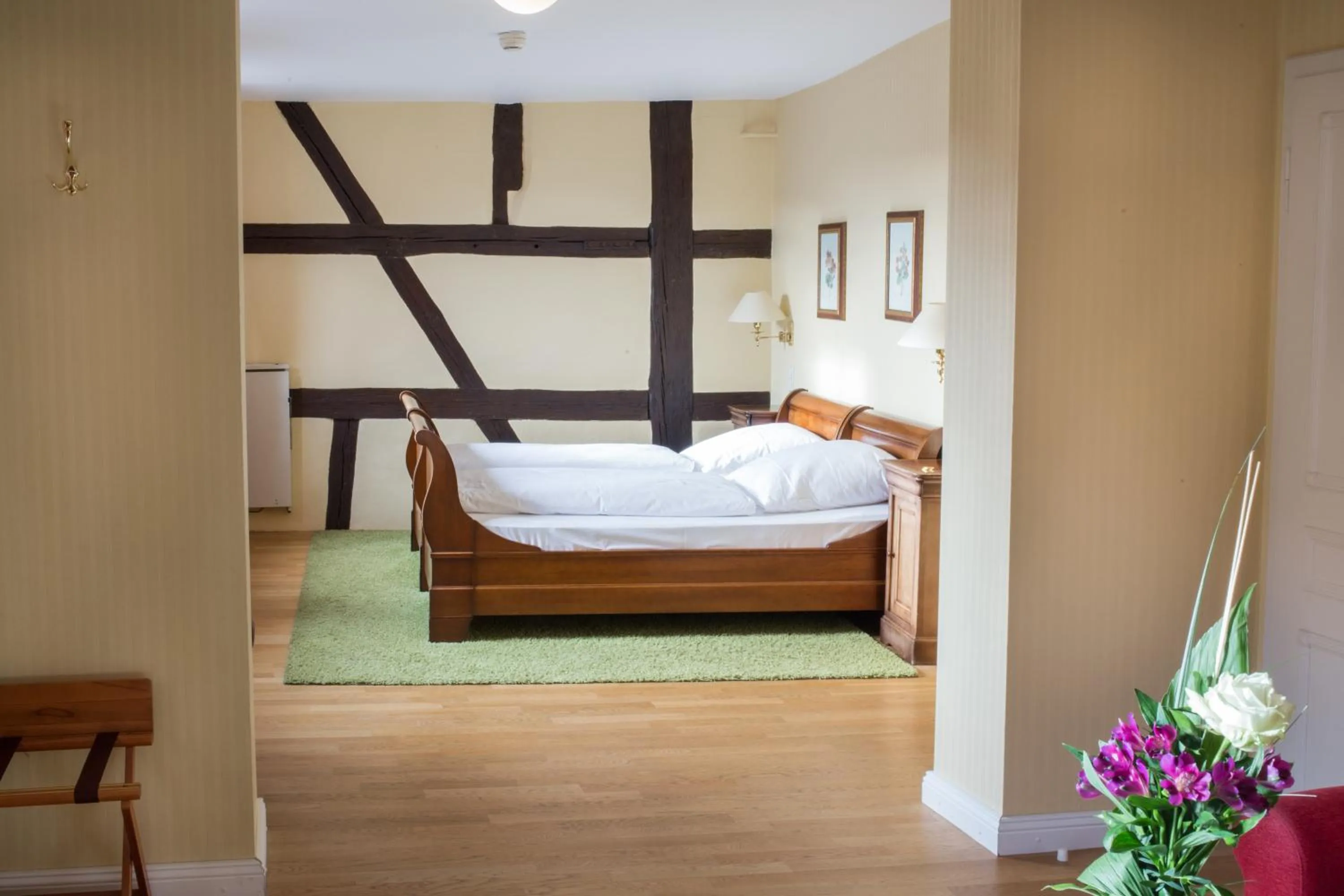 Photo of the whole room, Bed in WAGNERS Hotel Greifen-Post