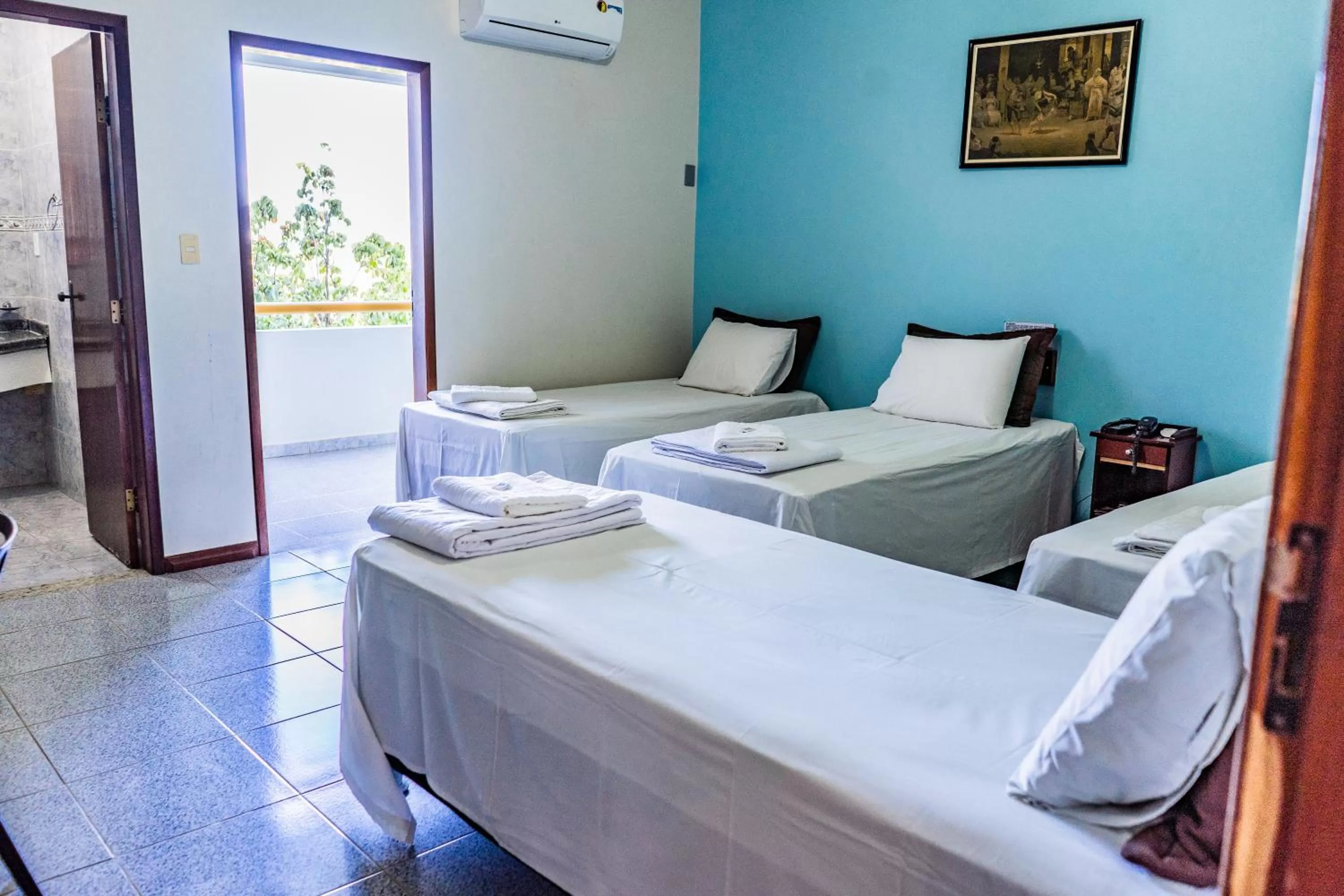 Bed in Pousada Paraiso