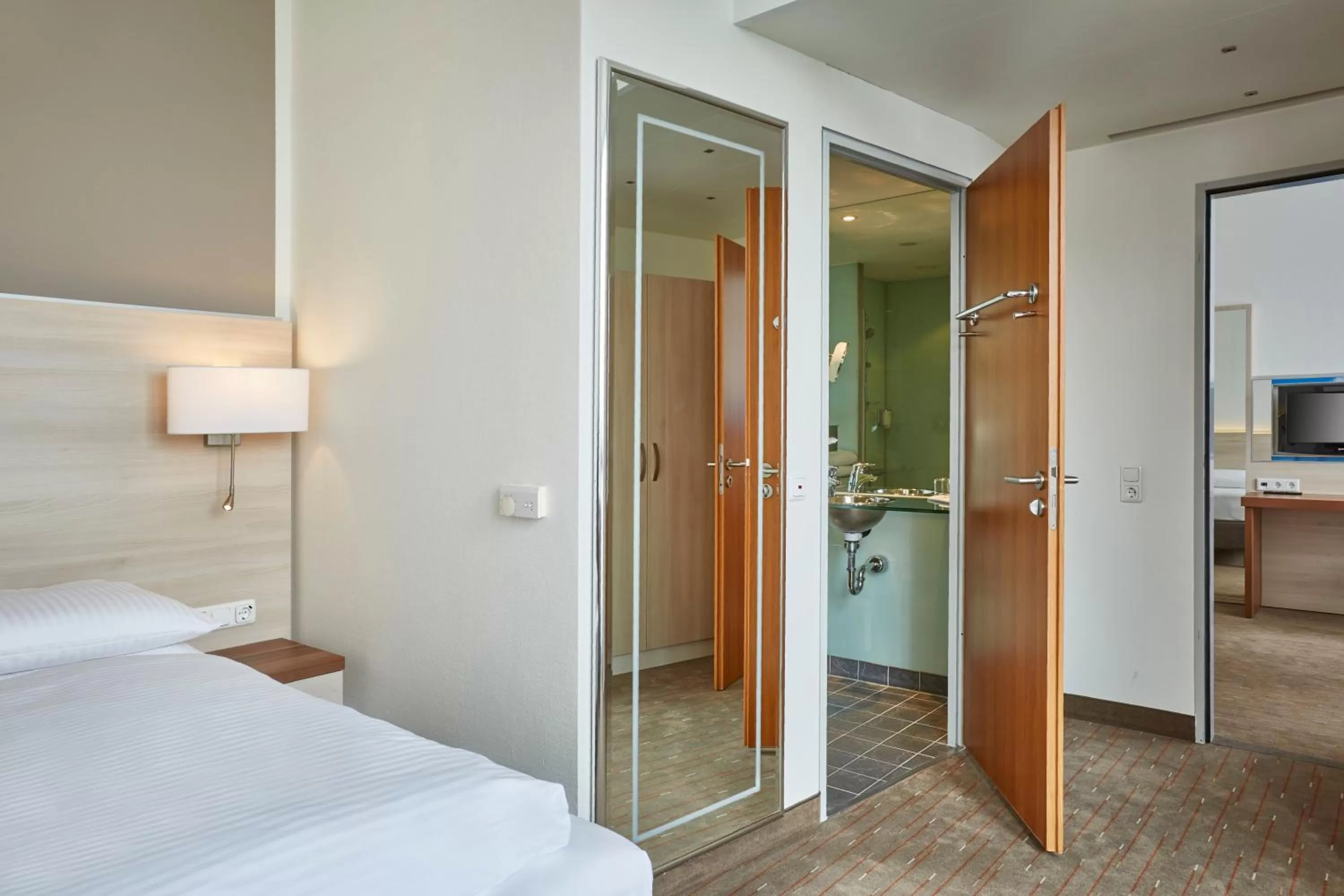 Photo of the whole room, Bed in H+ Hotel Berlin Mitte