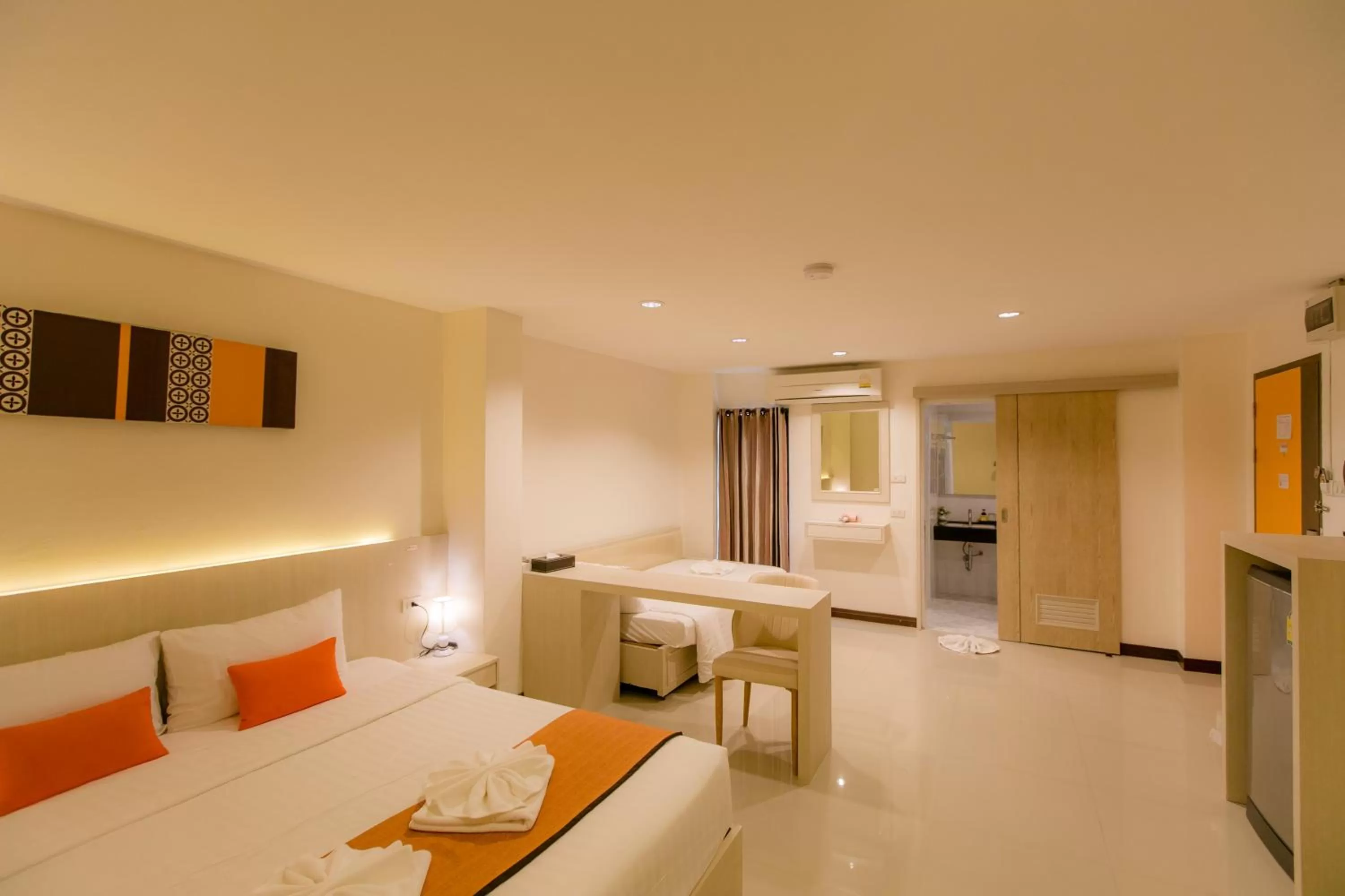 Bed in De Hug Hotel & Residence