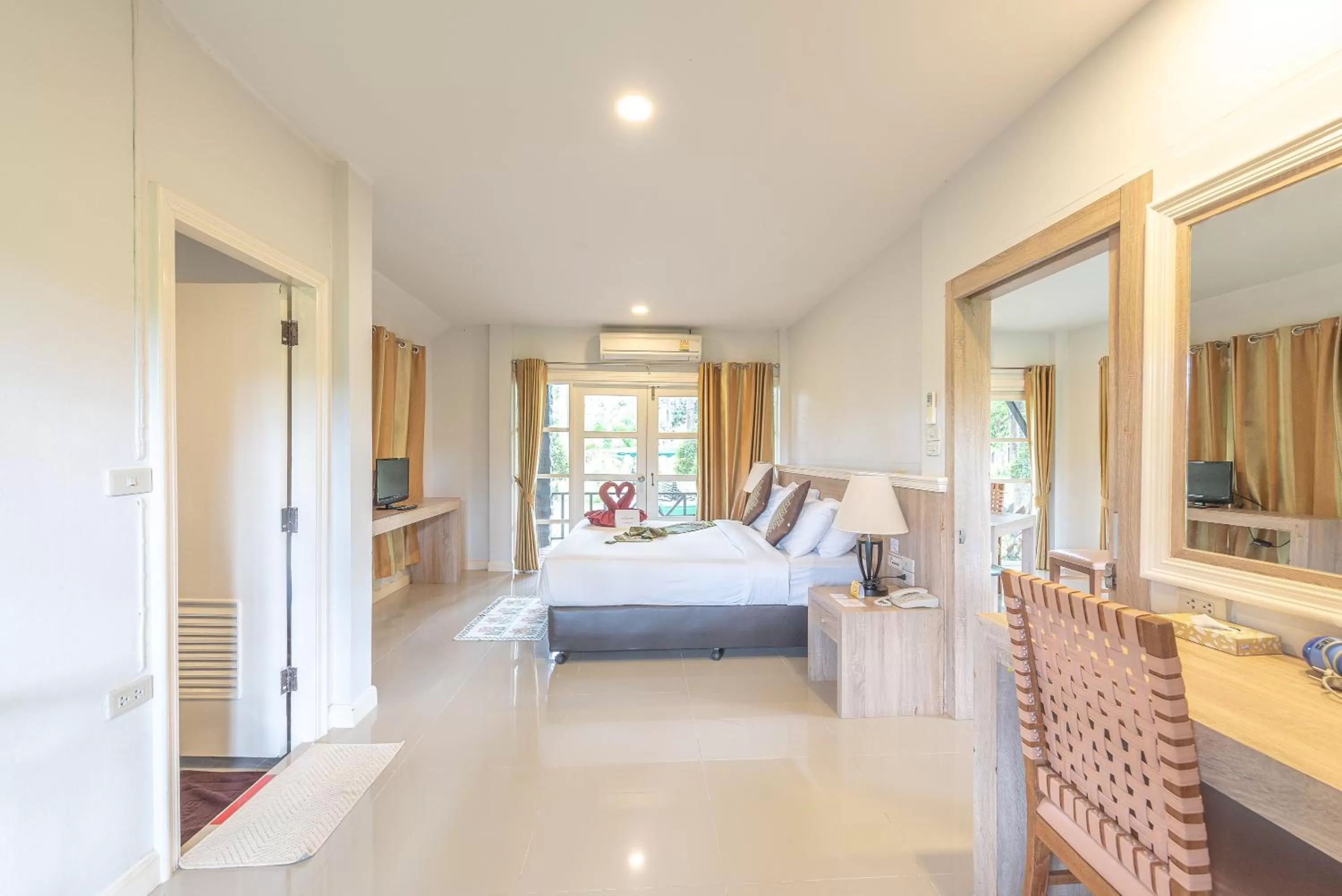 Living room, Bed in The Legacy River Kwai Resort