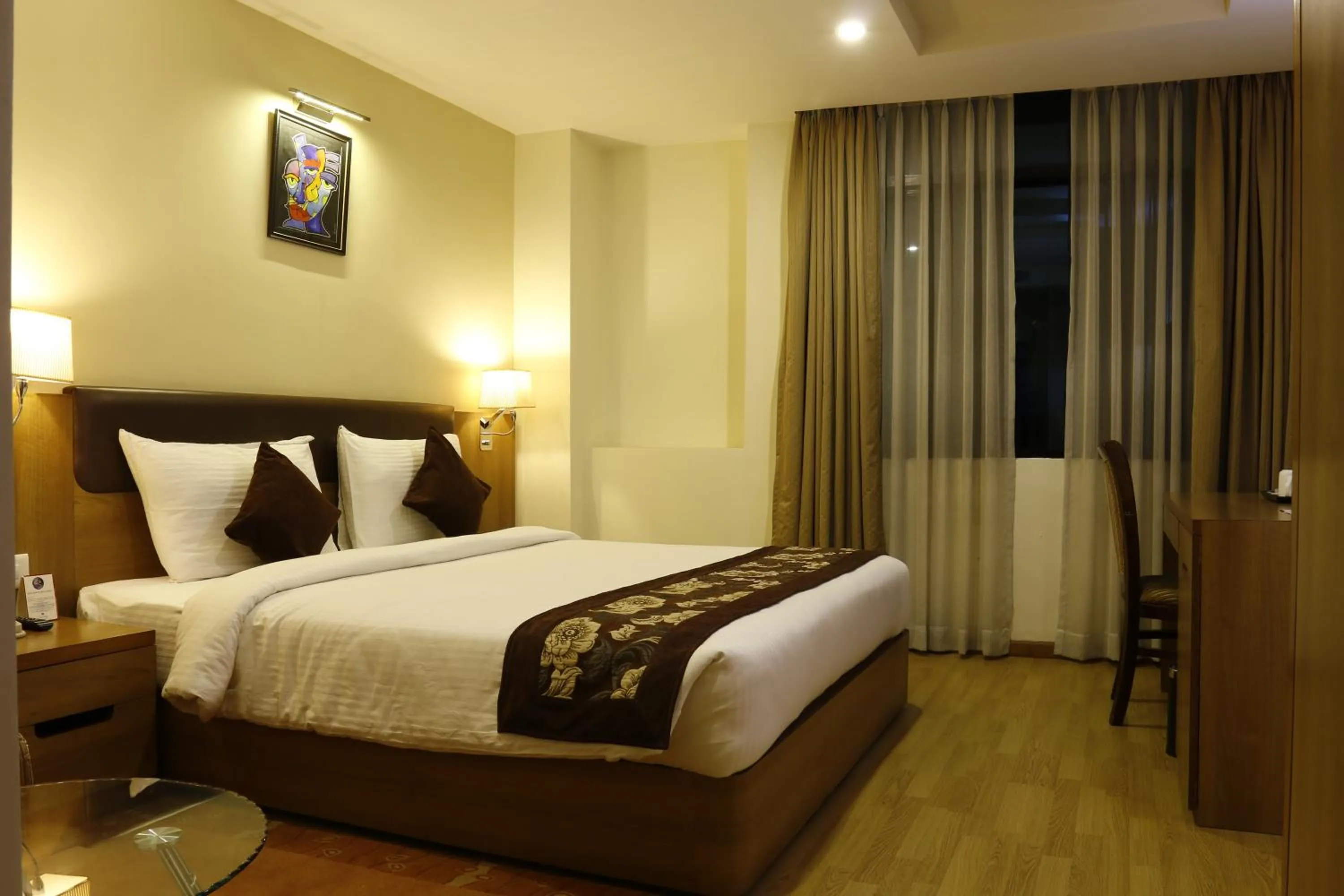 Bed in Hotel Mirage Regency