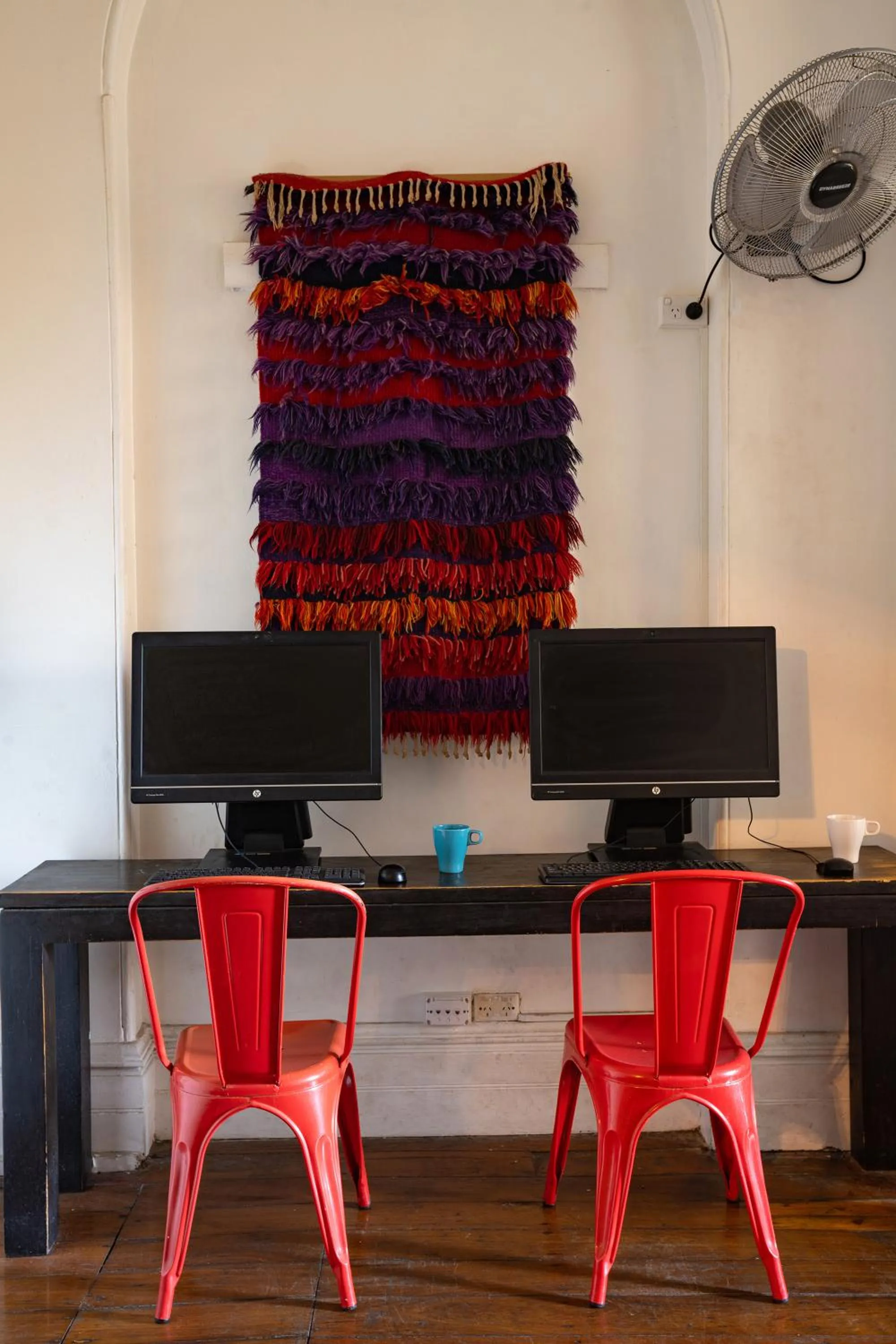 Communal lounge/ TV room in Original Backpackers