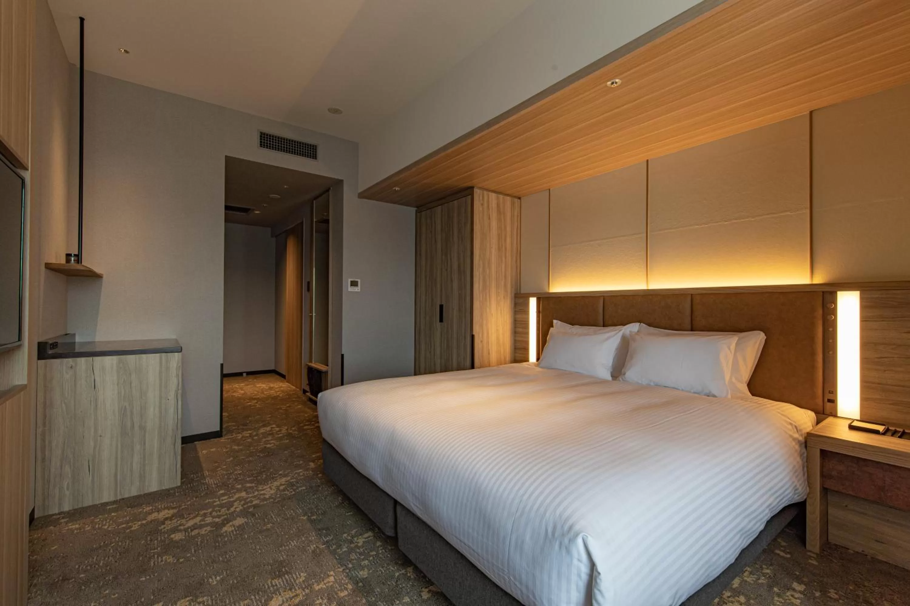 Bed in THE BLOSSOM HAKATA Premier