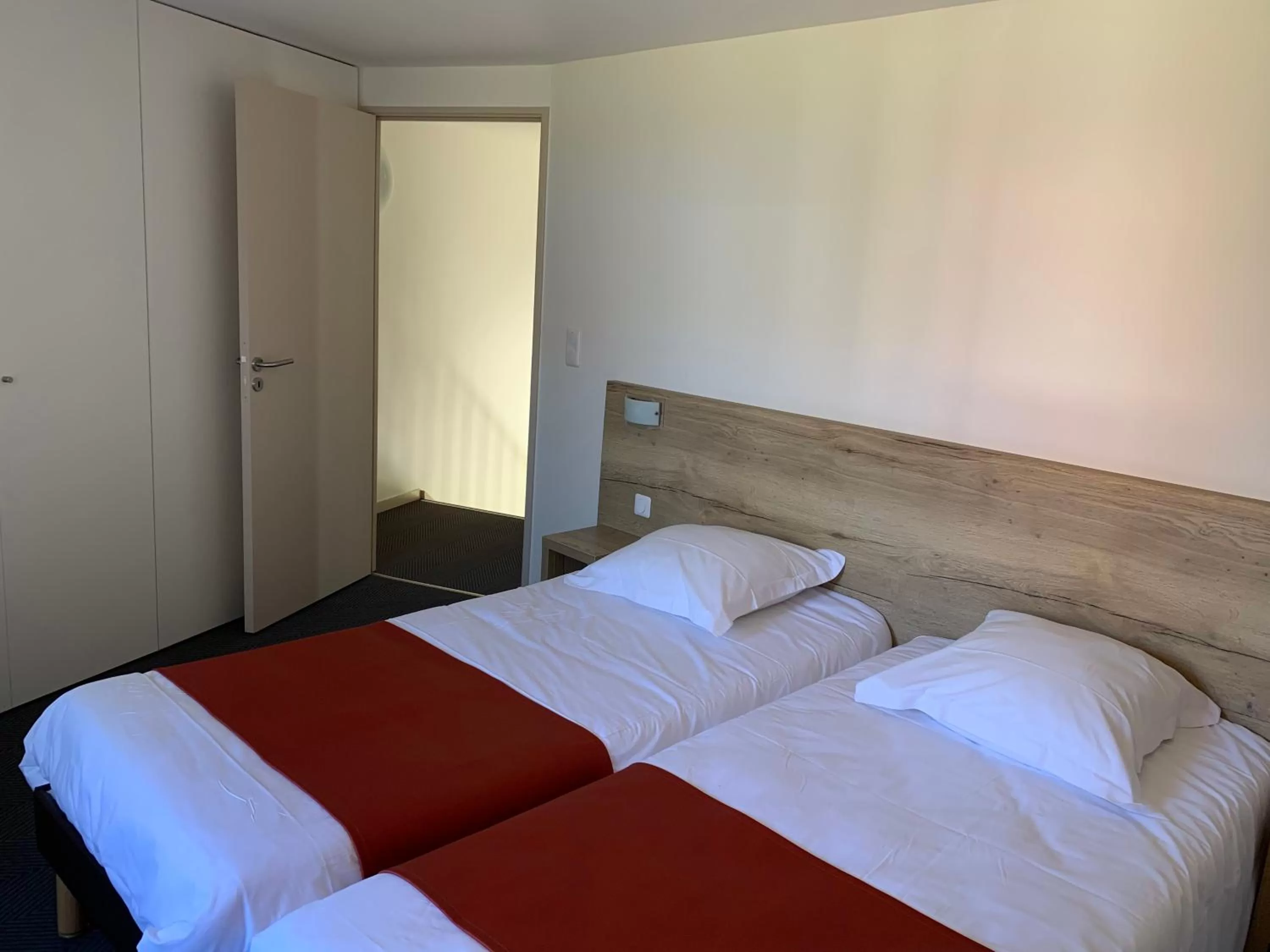 Photo of the whole room, Bed in Hôtel Lac d'Orient