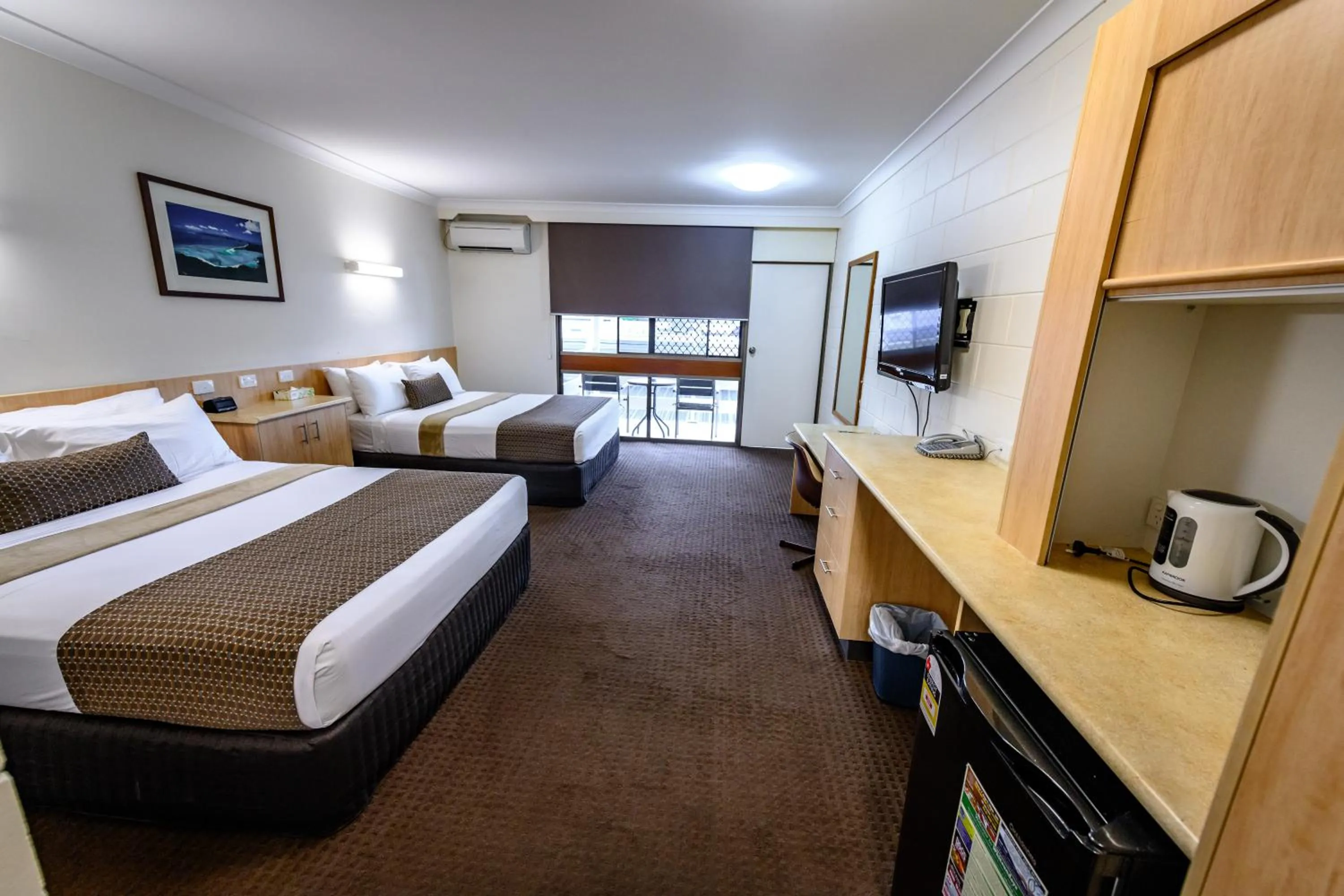 Bed in Reef Gateway Hotel