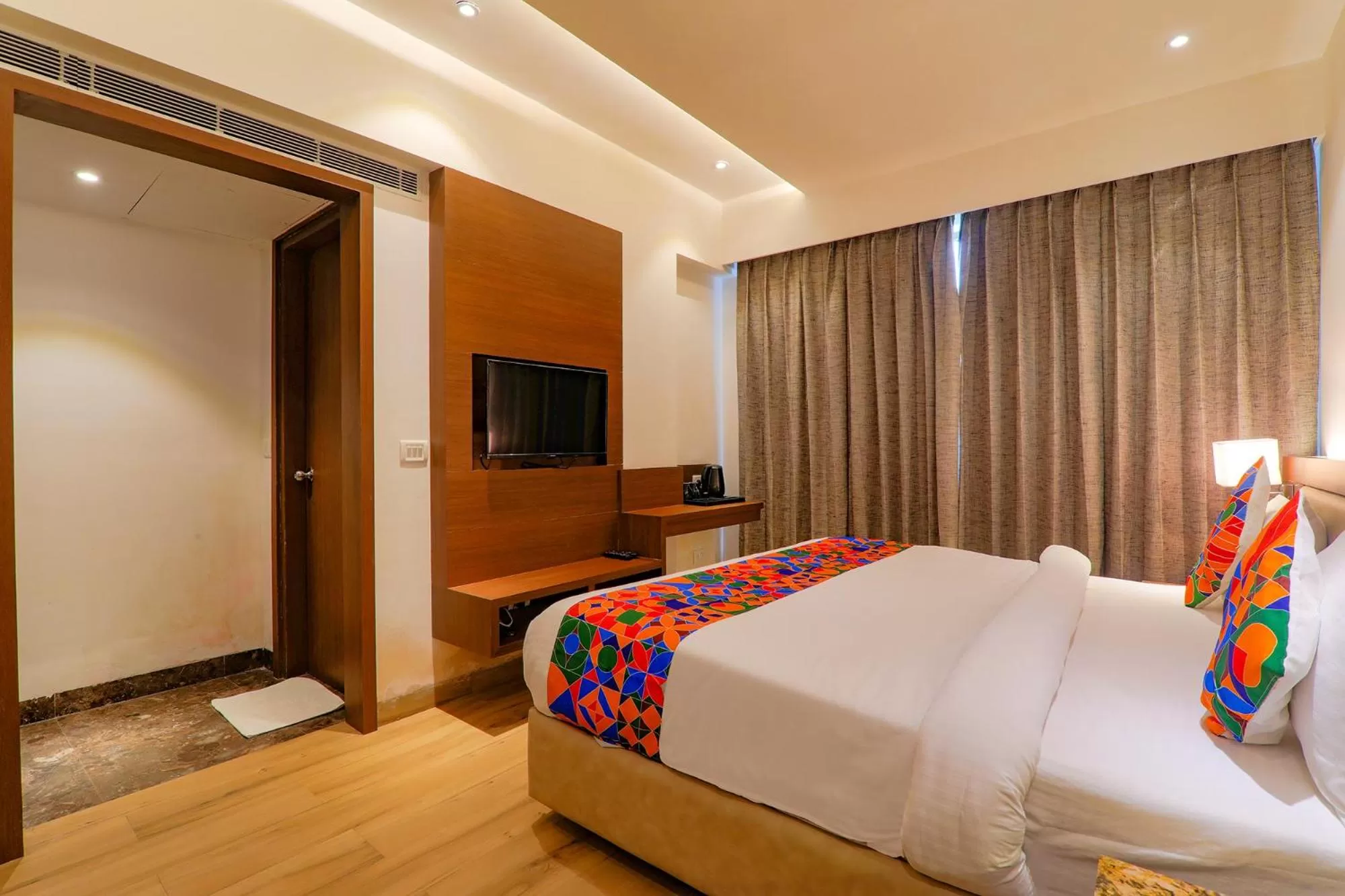 Bed in FabHotel Aurelia Grand