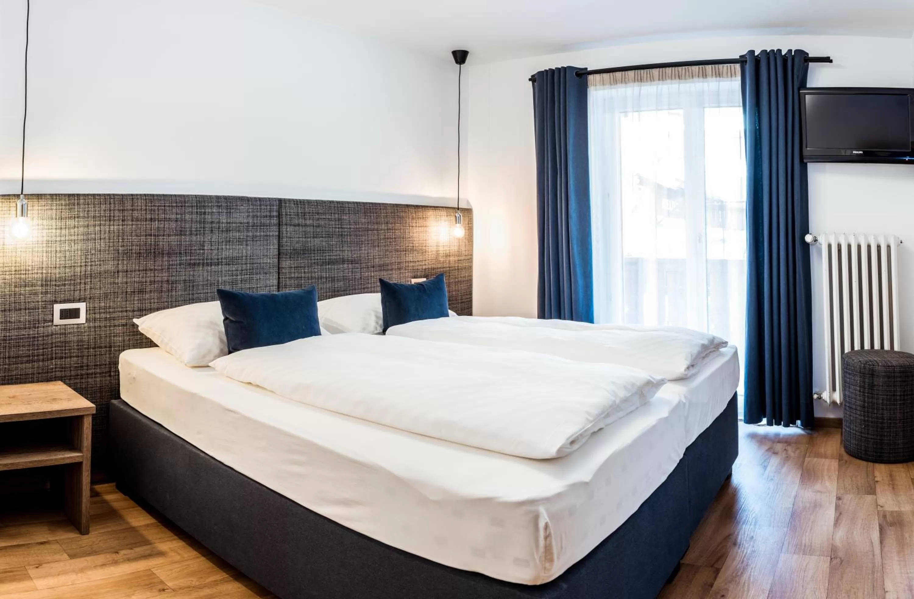 Bed in Linder Cycling Hotel