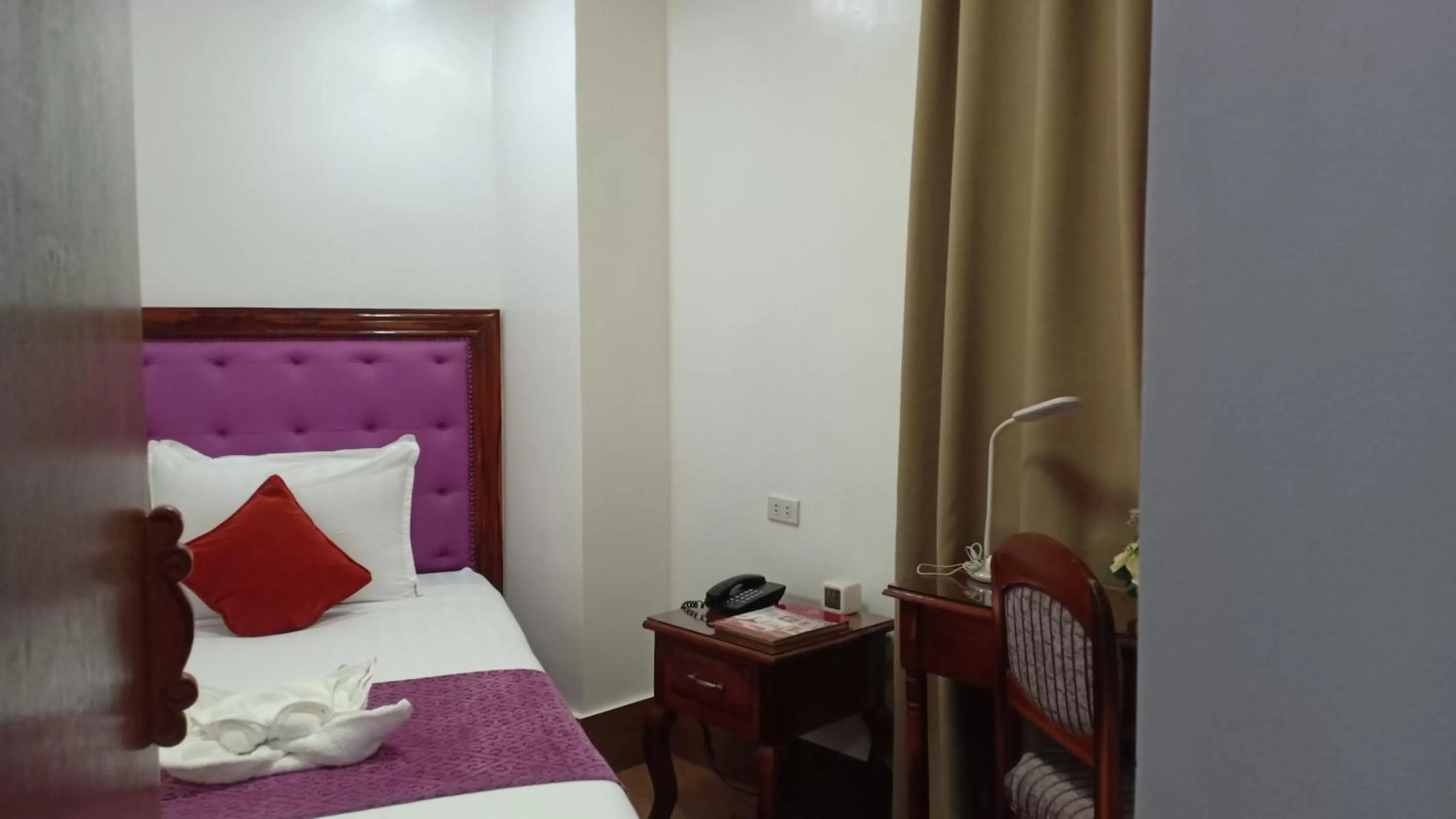 Bed in CLN Boutique Hotel