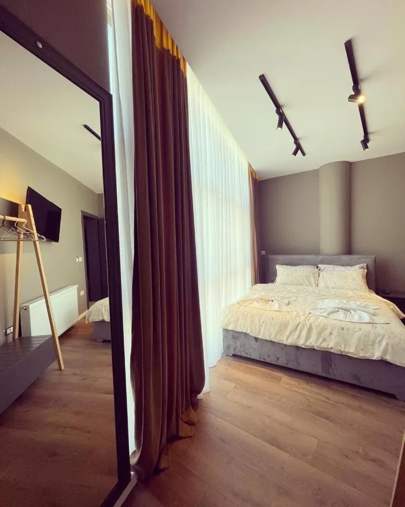 Bed in GRAND JNK Boutique Hotel