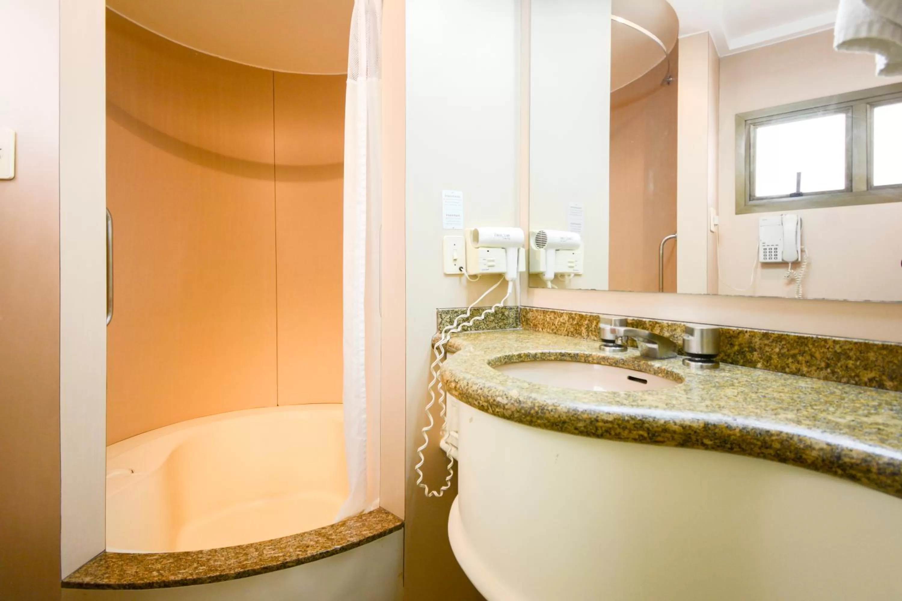 Bathroom in Wall Street Apartments by BnbHost
