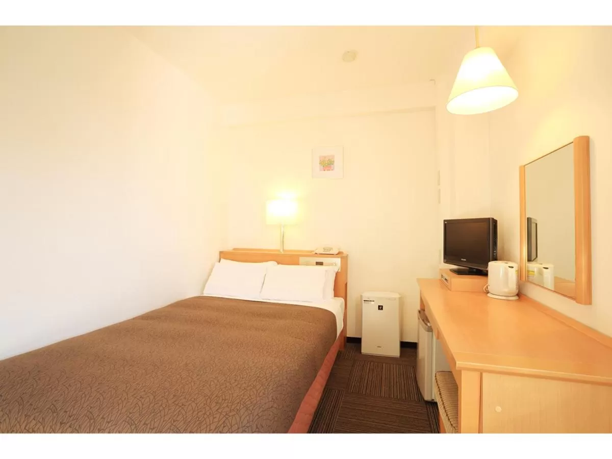 Bed in Smile Hotel Shizuoka