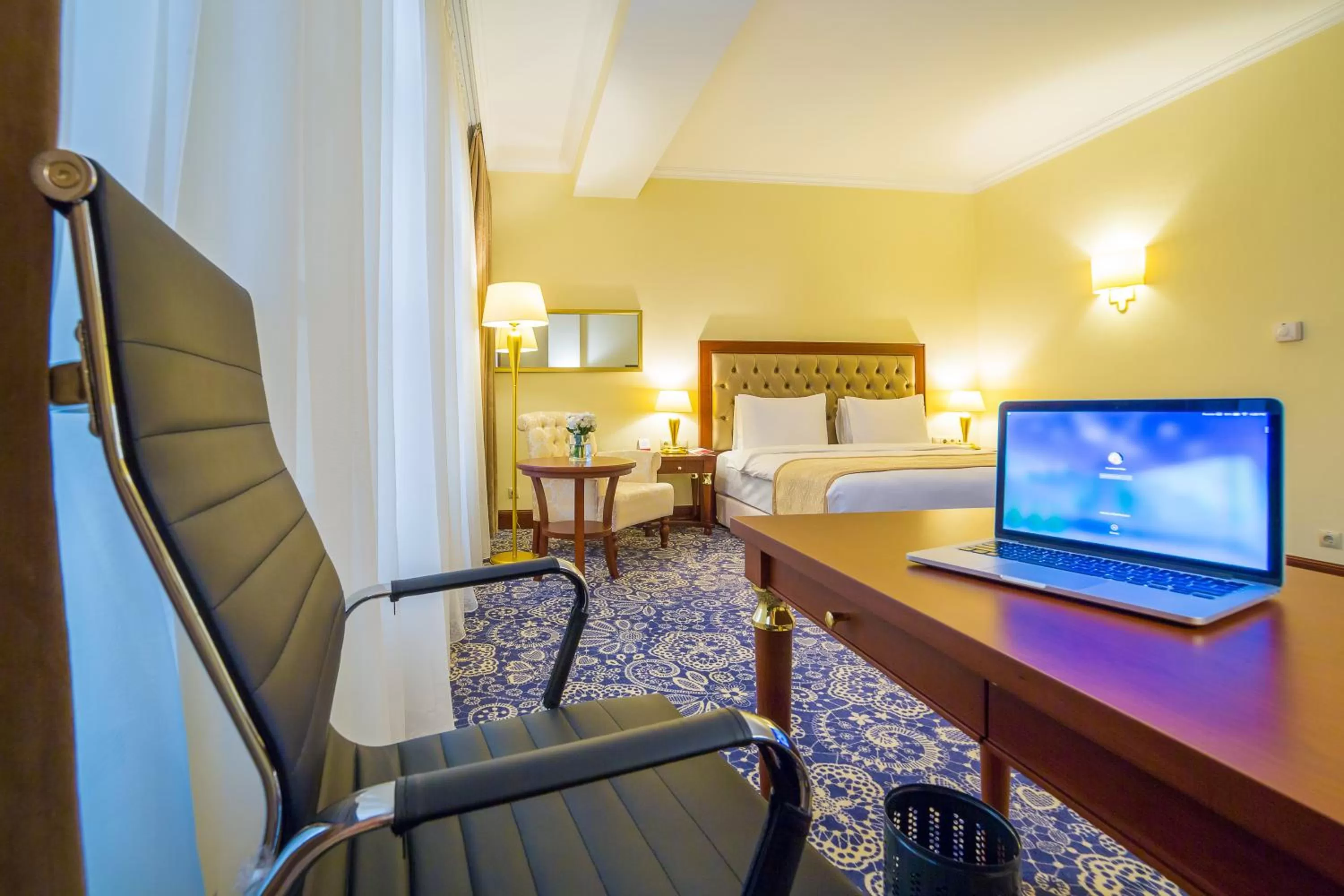 Seating area, Bed in Ramada by Wyndham Almaty