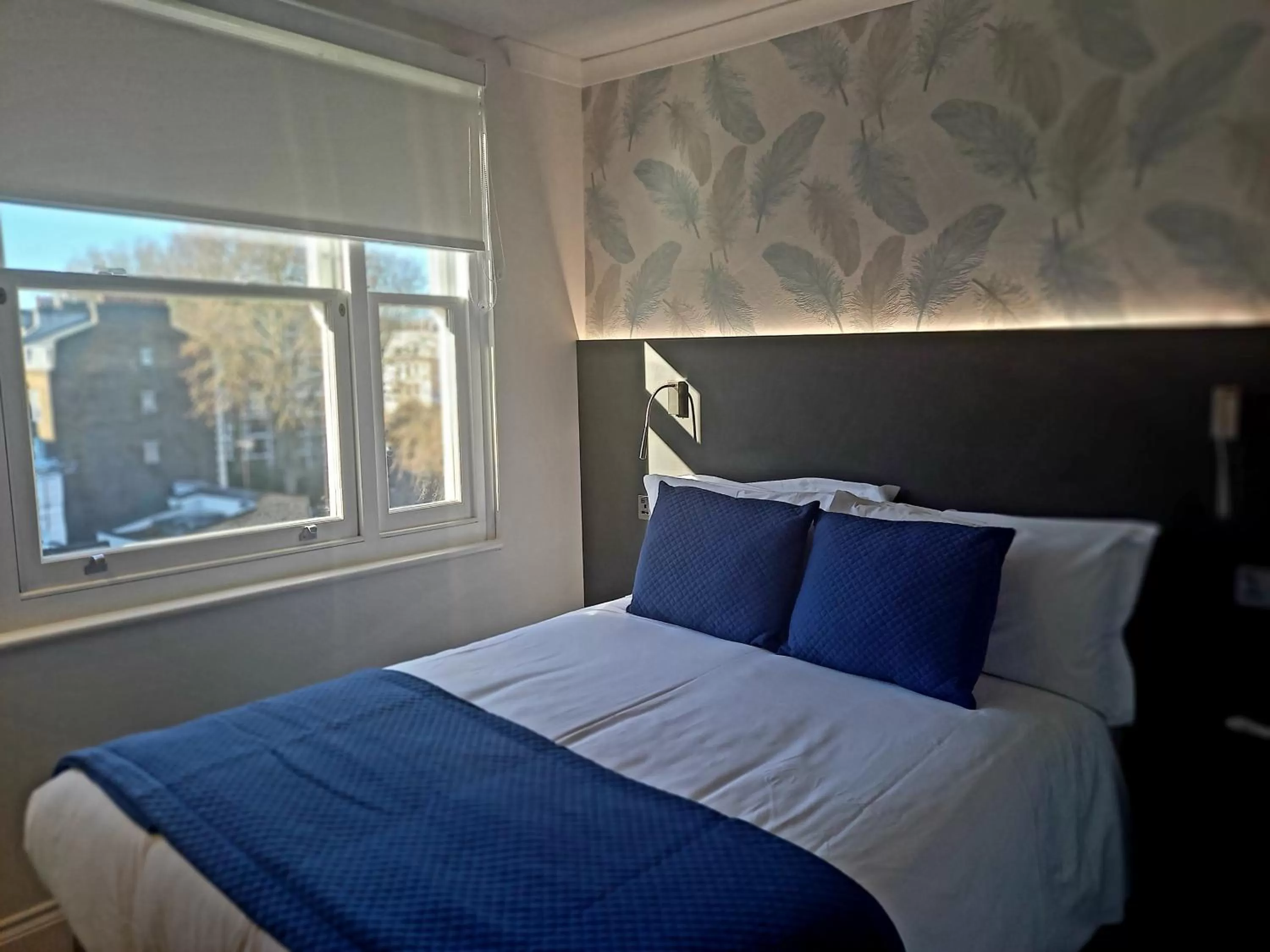 Bed in Commodore Hotel