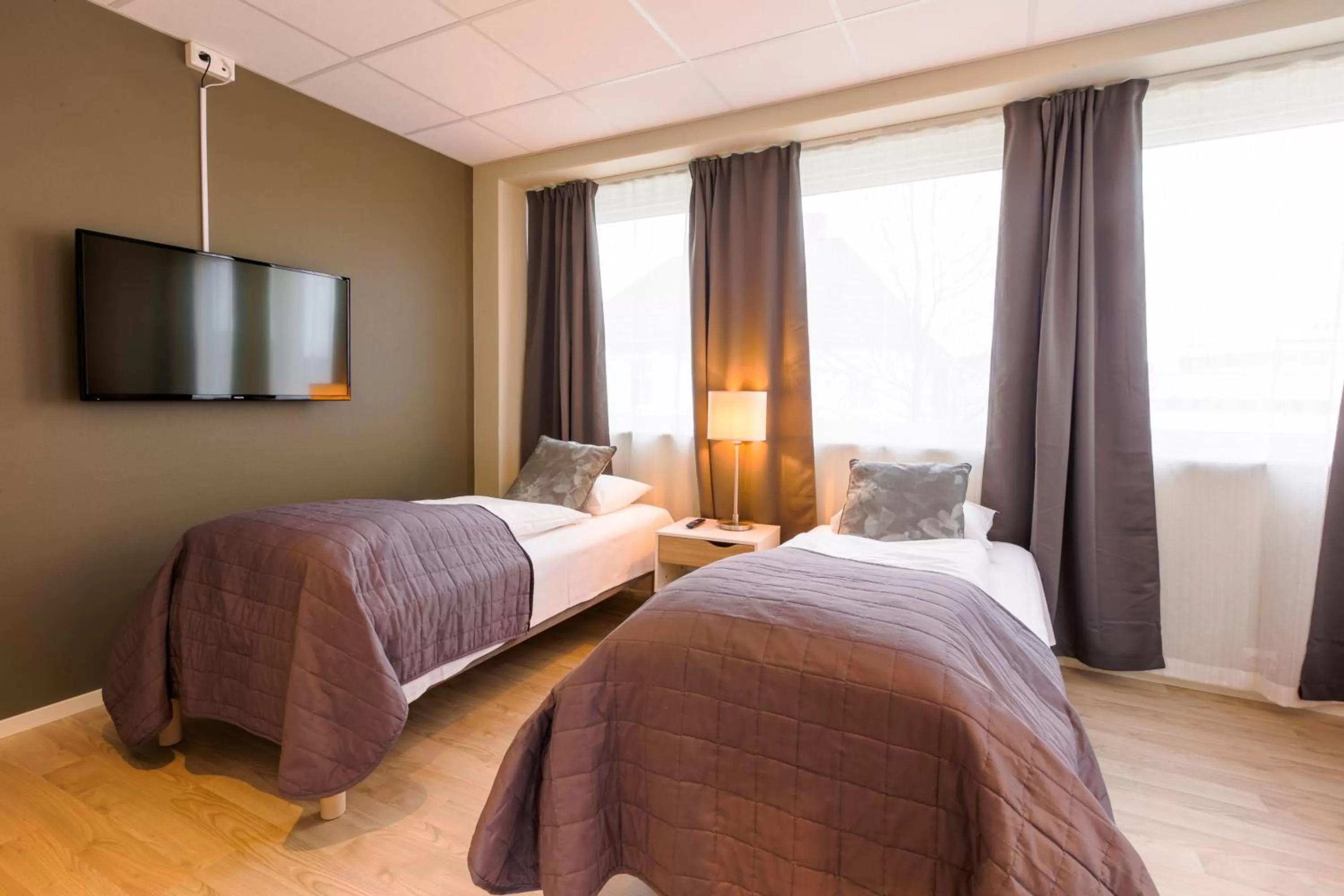 Bed in Corner Hotell