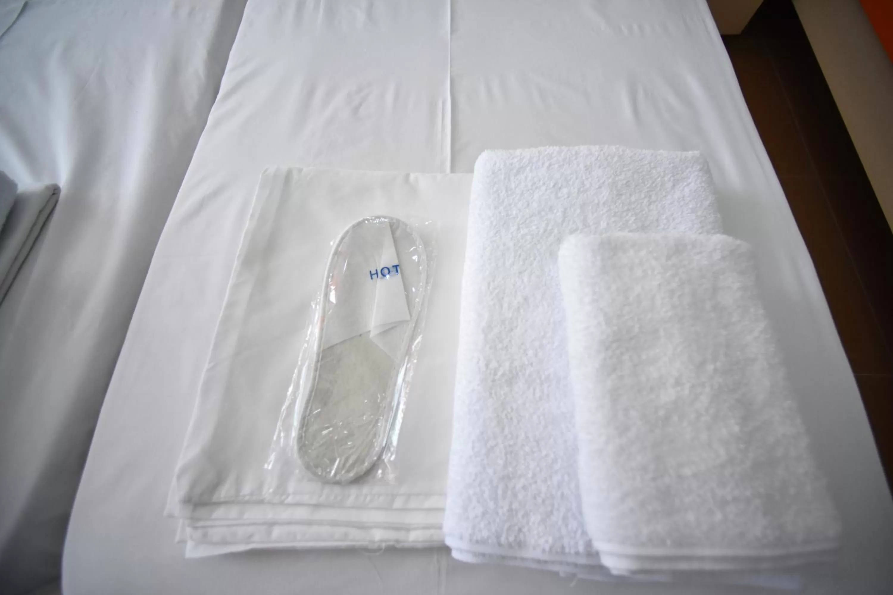 Bed in Orange Home Hotel