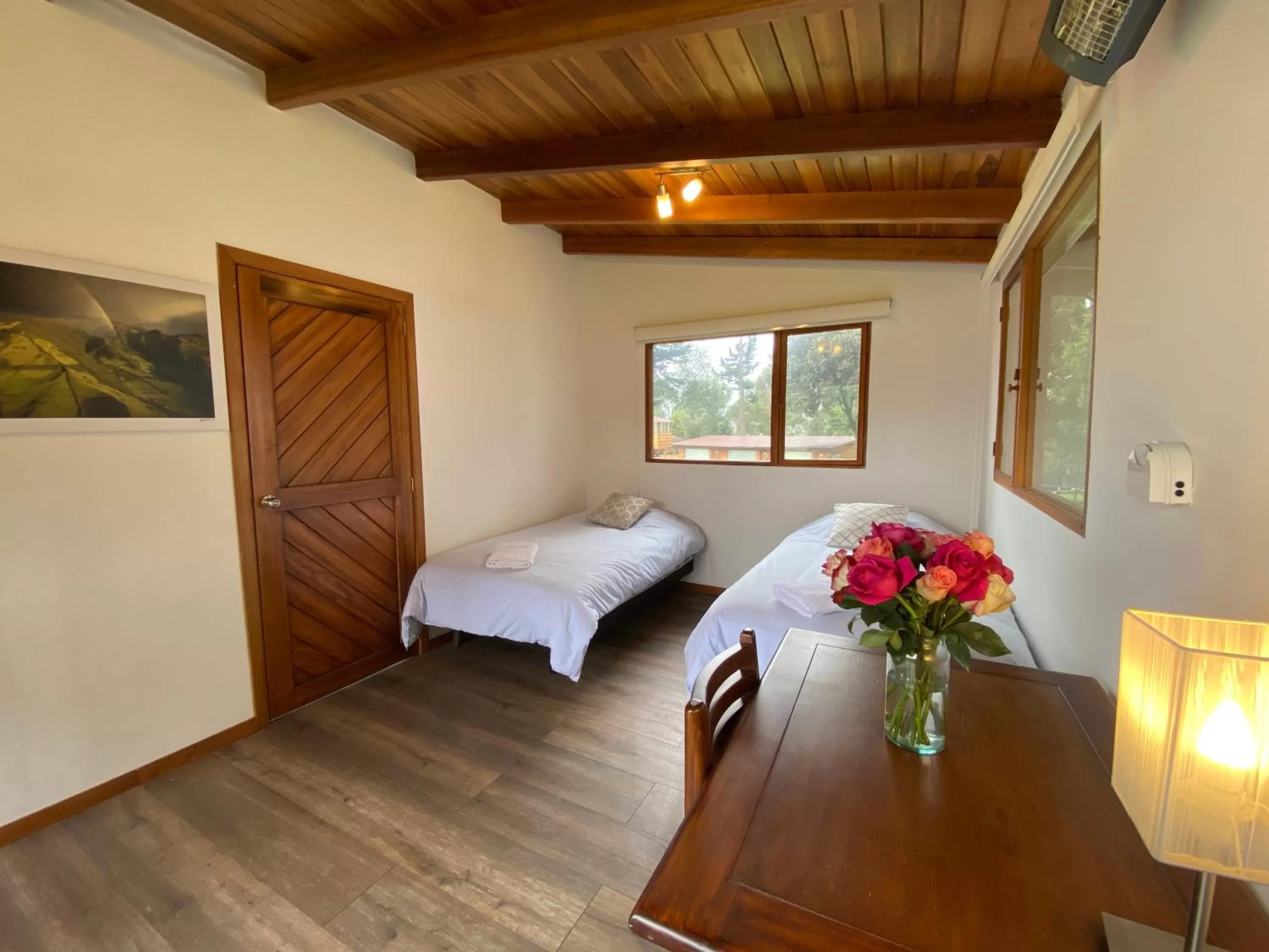 Bed in Hosteria Papagayo Cotopaxi