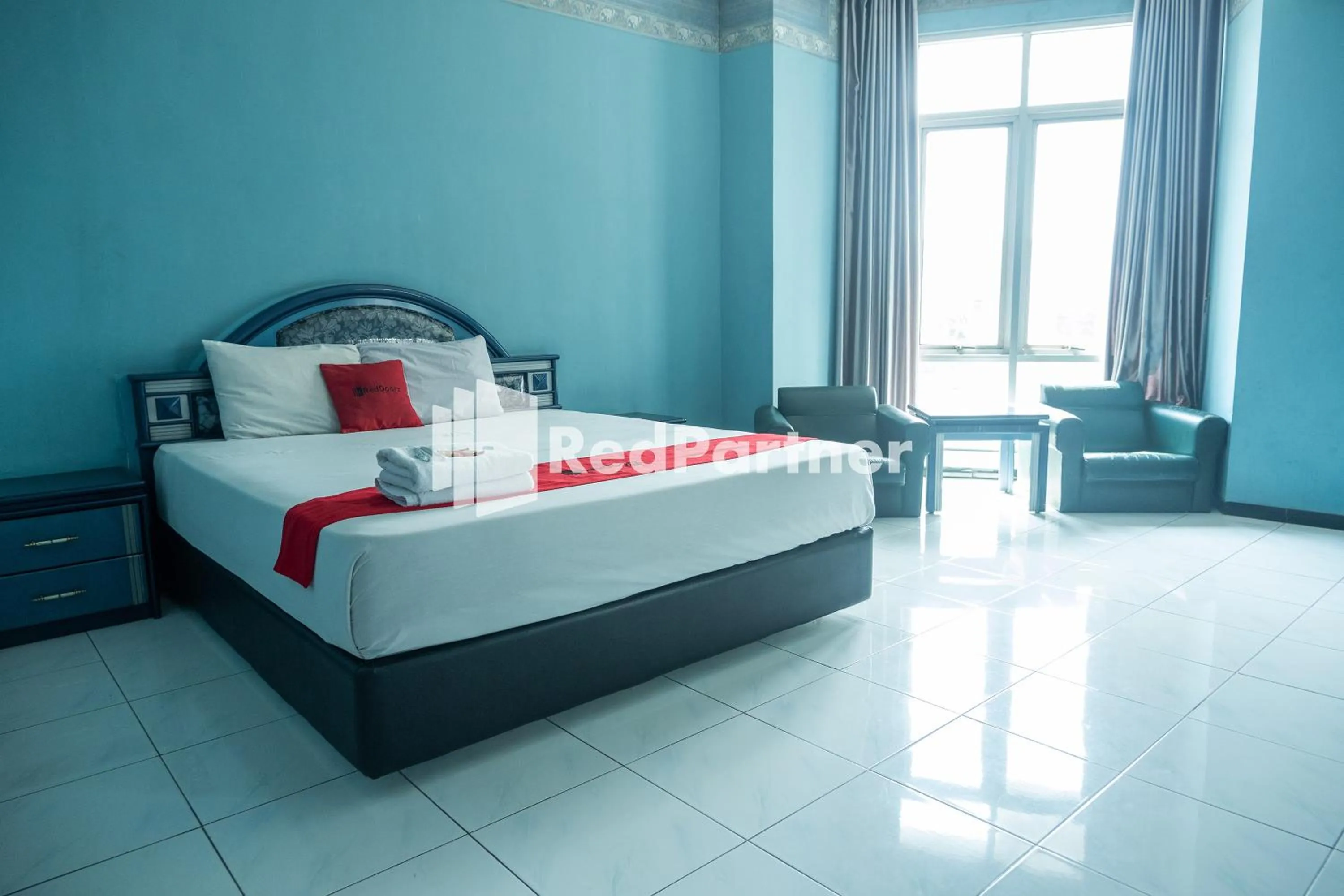 Bed in Akur Hotel Malioboro Mitra RedDoorz