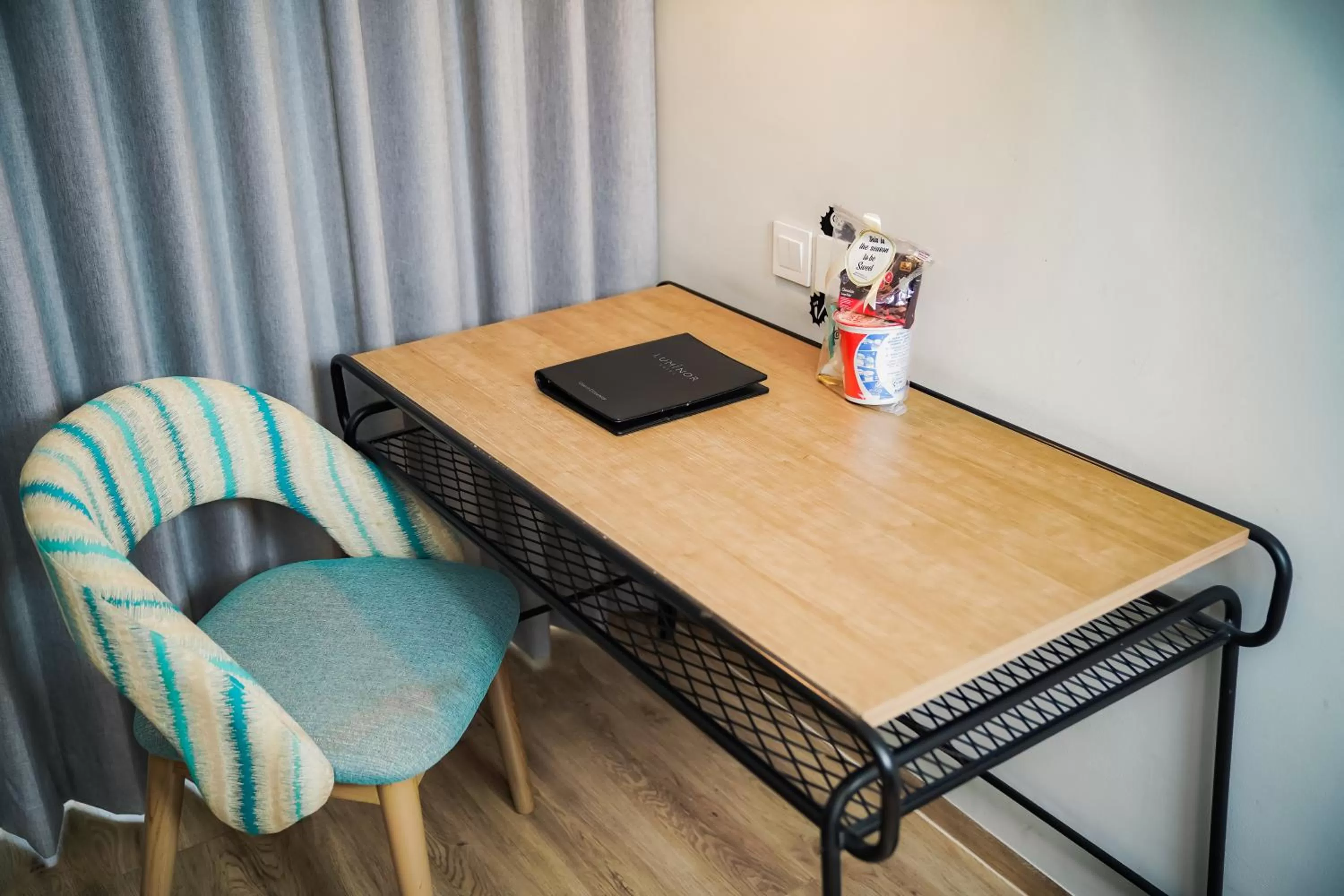 Seating area in Luminor Hotel Purwokerto By WH