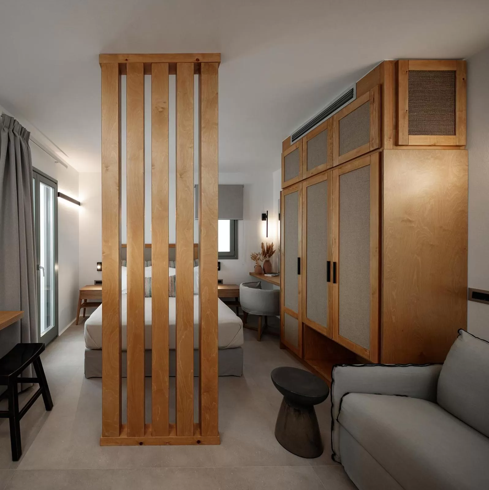 Bed, Seating Area in Makava Suites Naxos