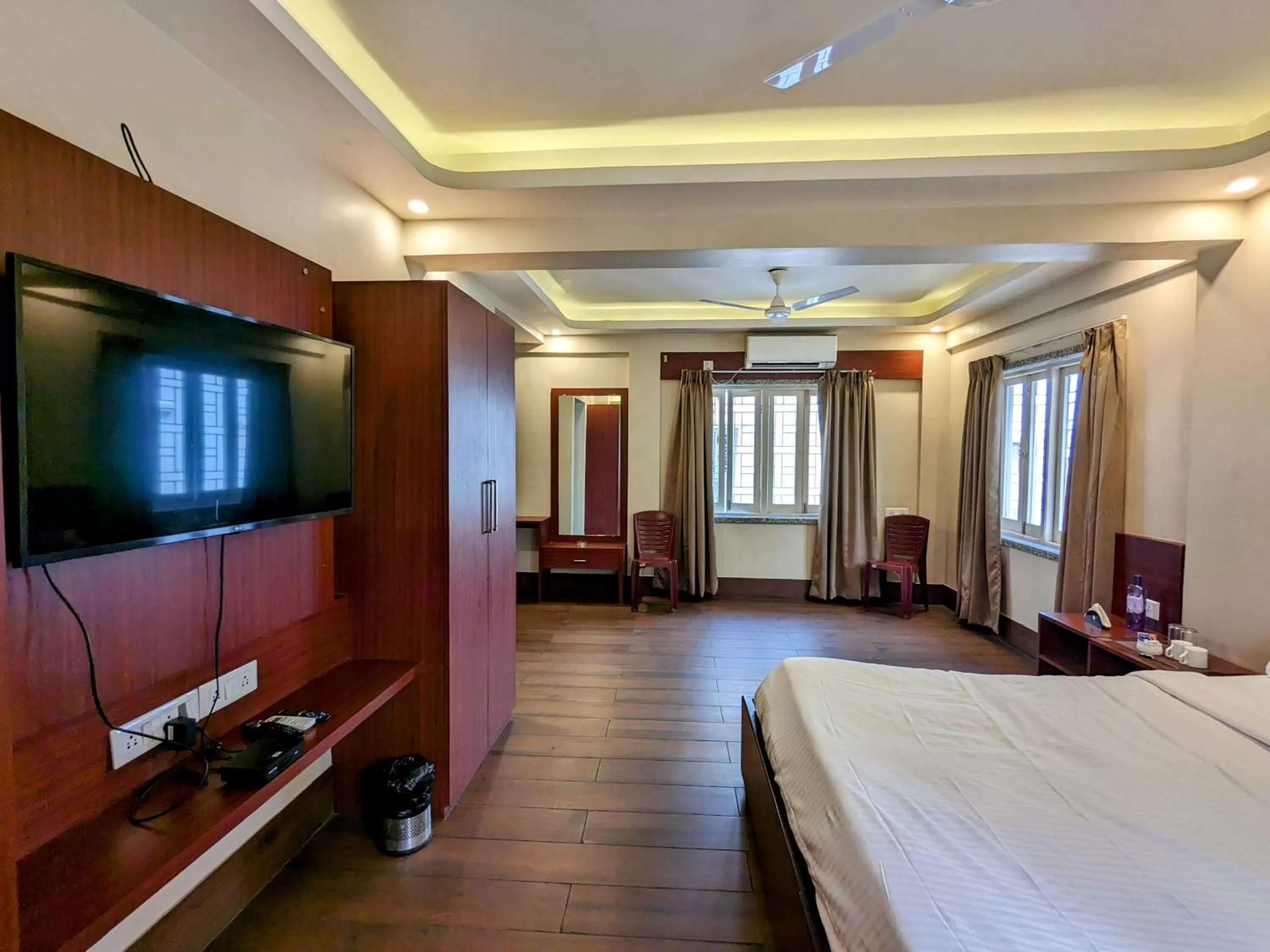 Bed in The Aster Enclave Hotel