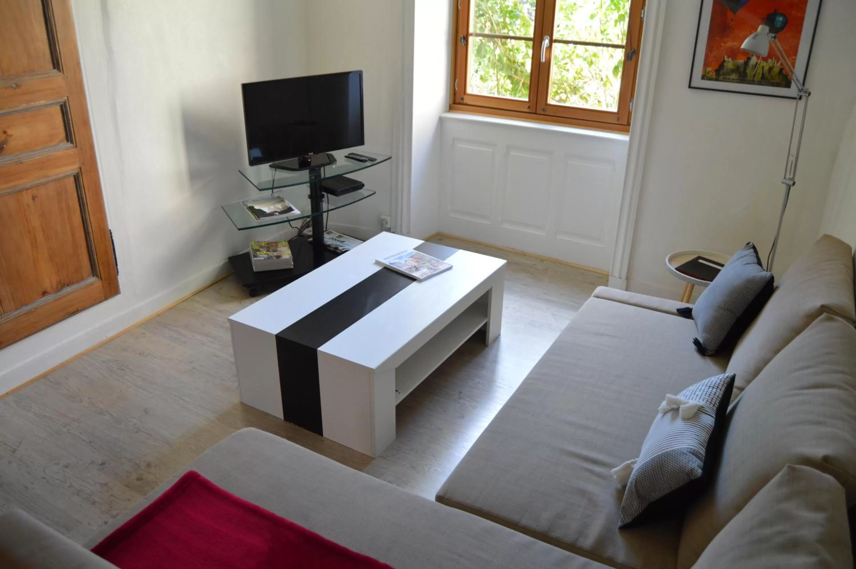 Communal lounge/ TV room in Le gîte du Bessat