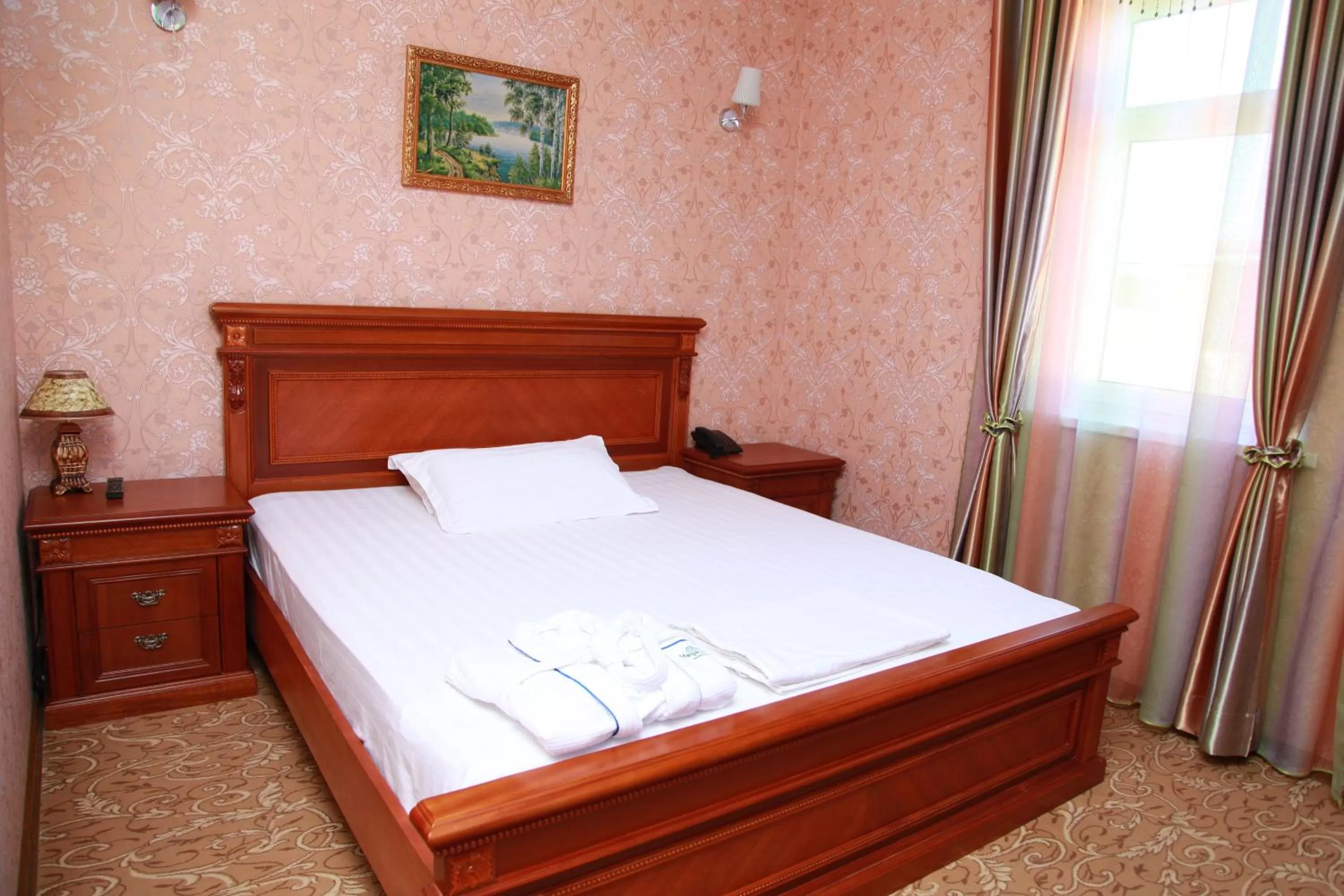 Bed in Maximum Hotel