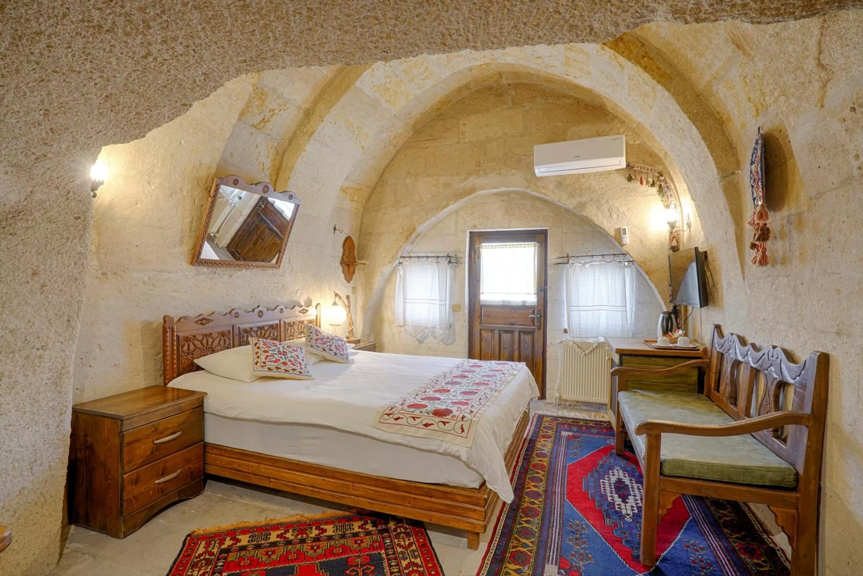 Bed in Tulip Cave Suites