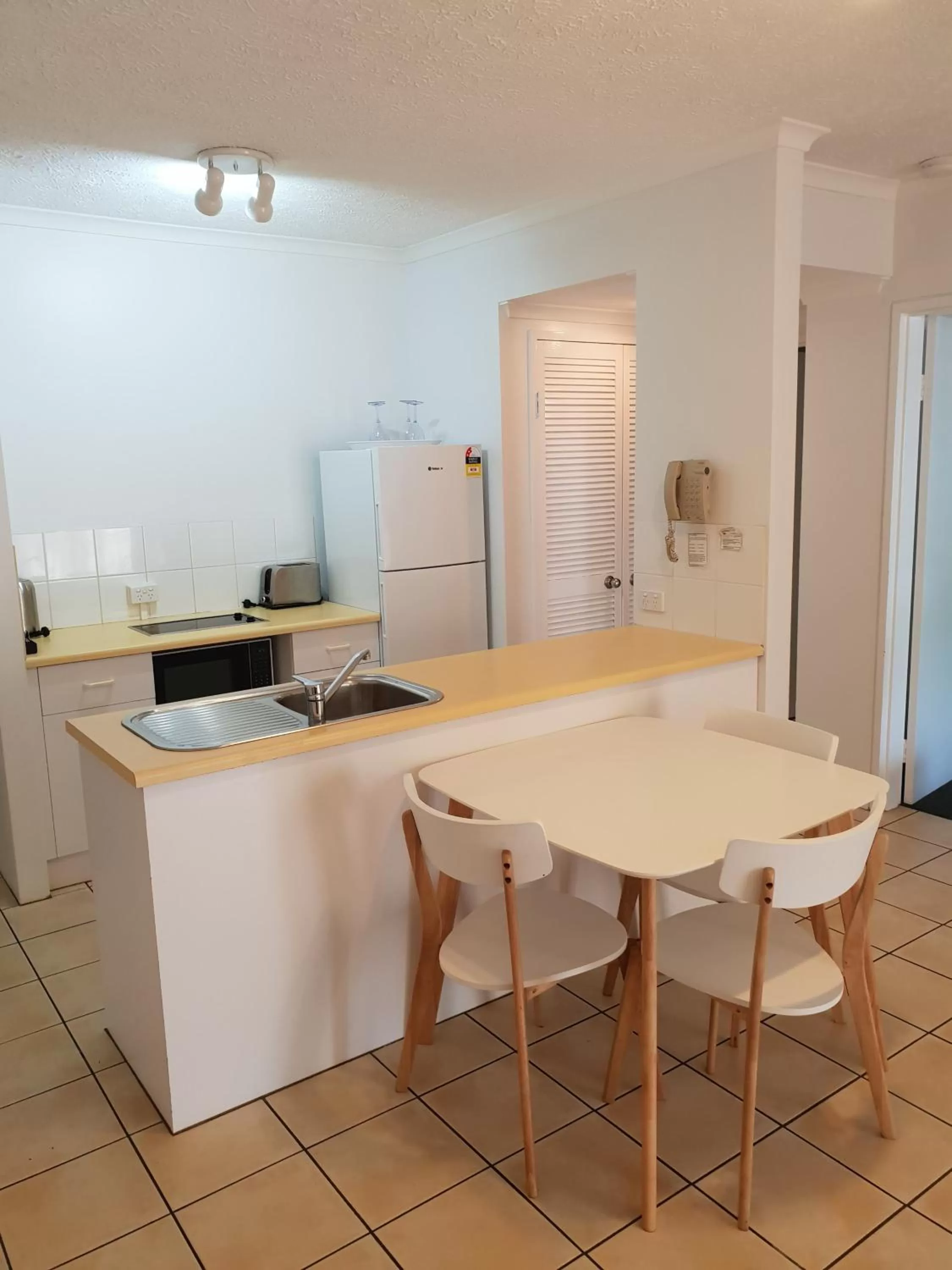Kitchen or kitchenette in Cairns Beach Resort