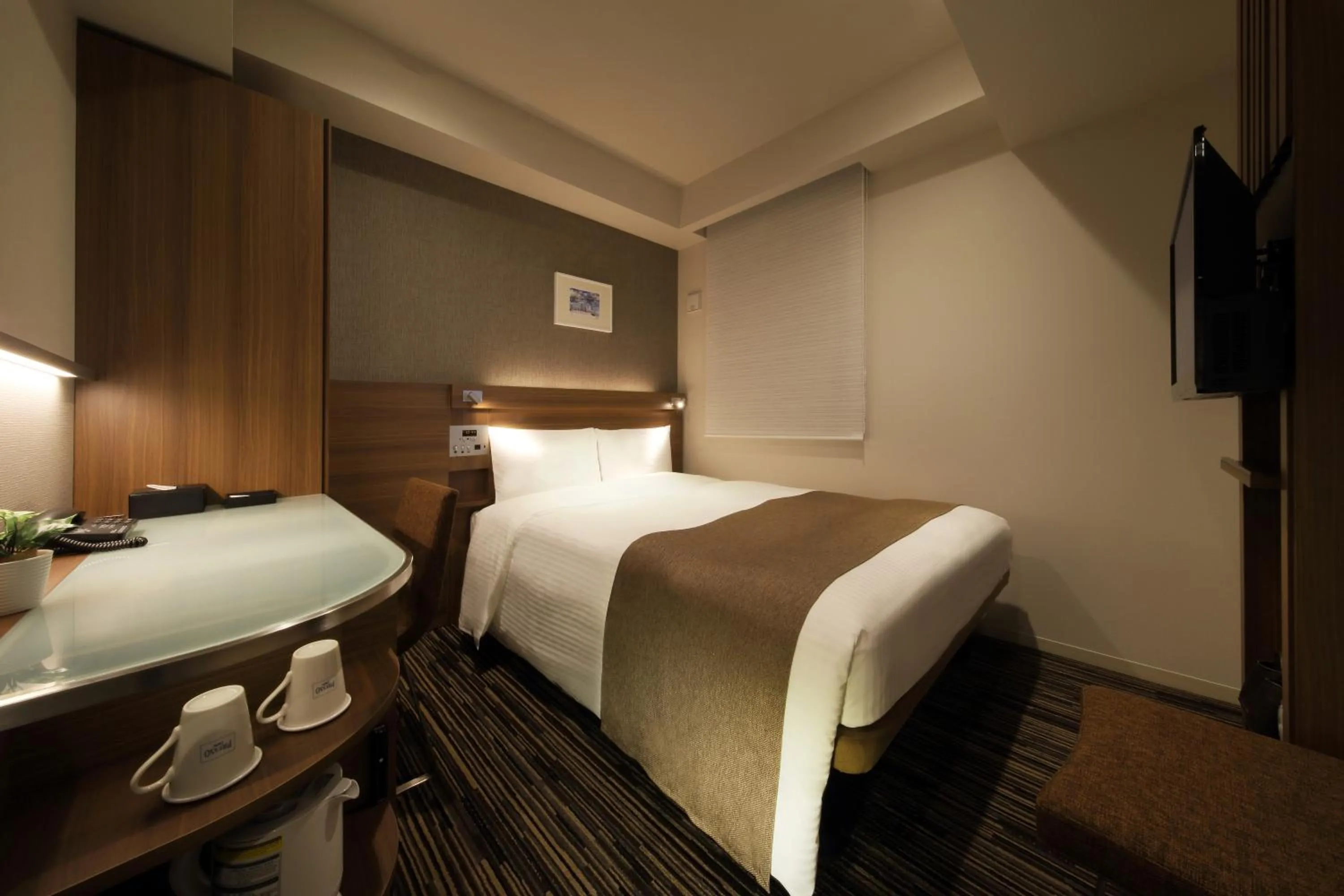 Bed in Keio Presso Inn Hamamatsucho