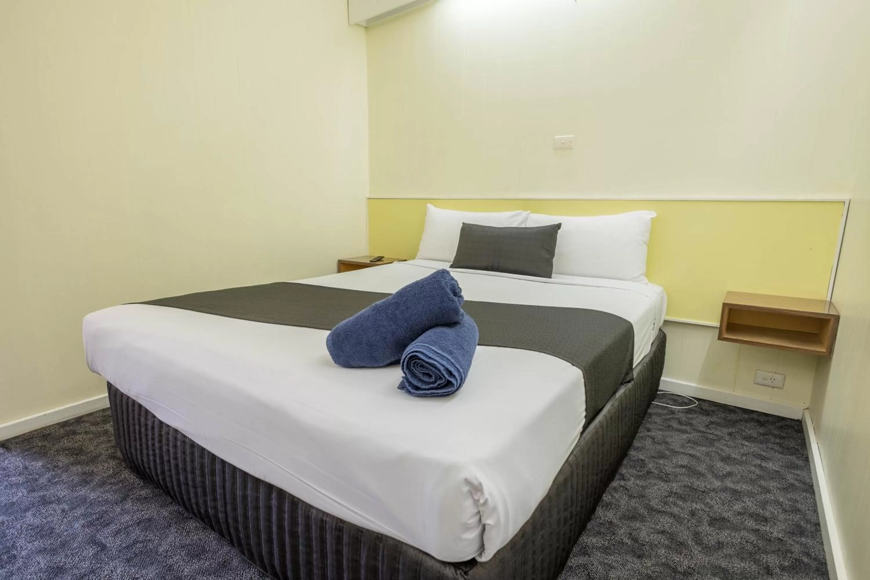 Bed in Pioneer Station Motor Inn