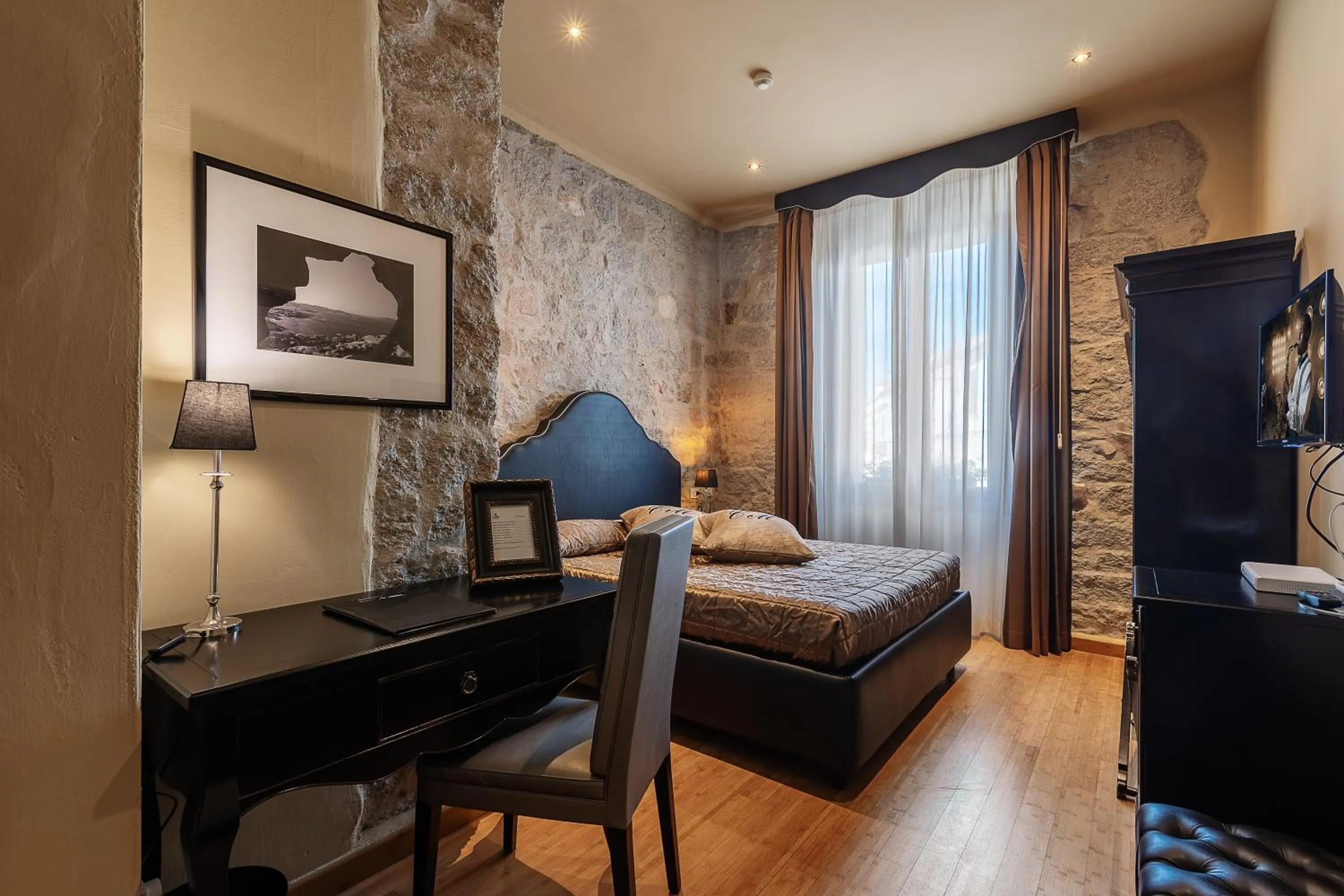 Bed in La Locanda Del Conte Mameli - Boutique Hotel & Suite SPA