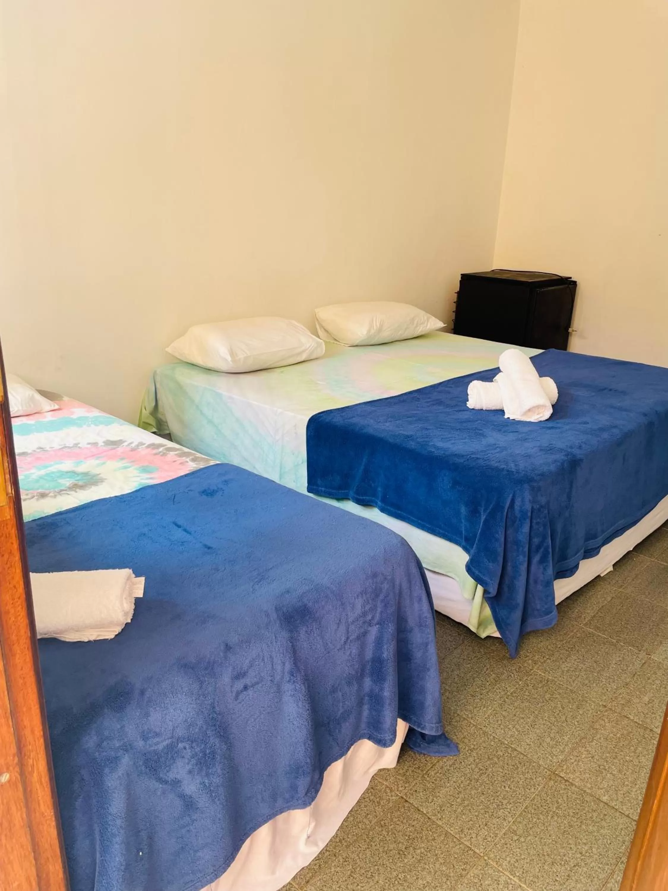 Bed in Pousada Praia do Tombo