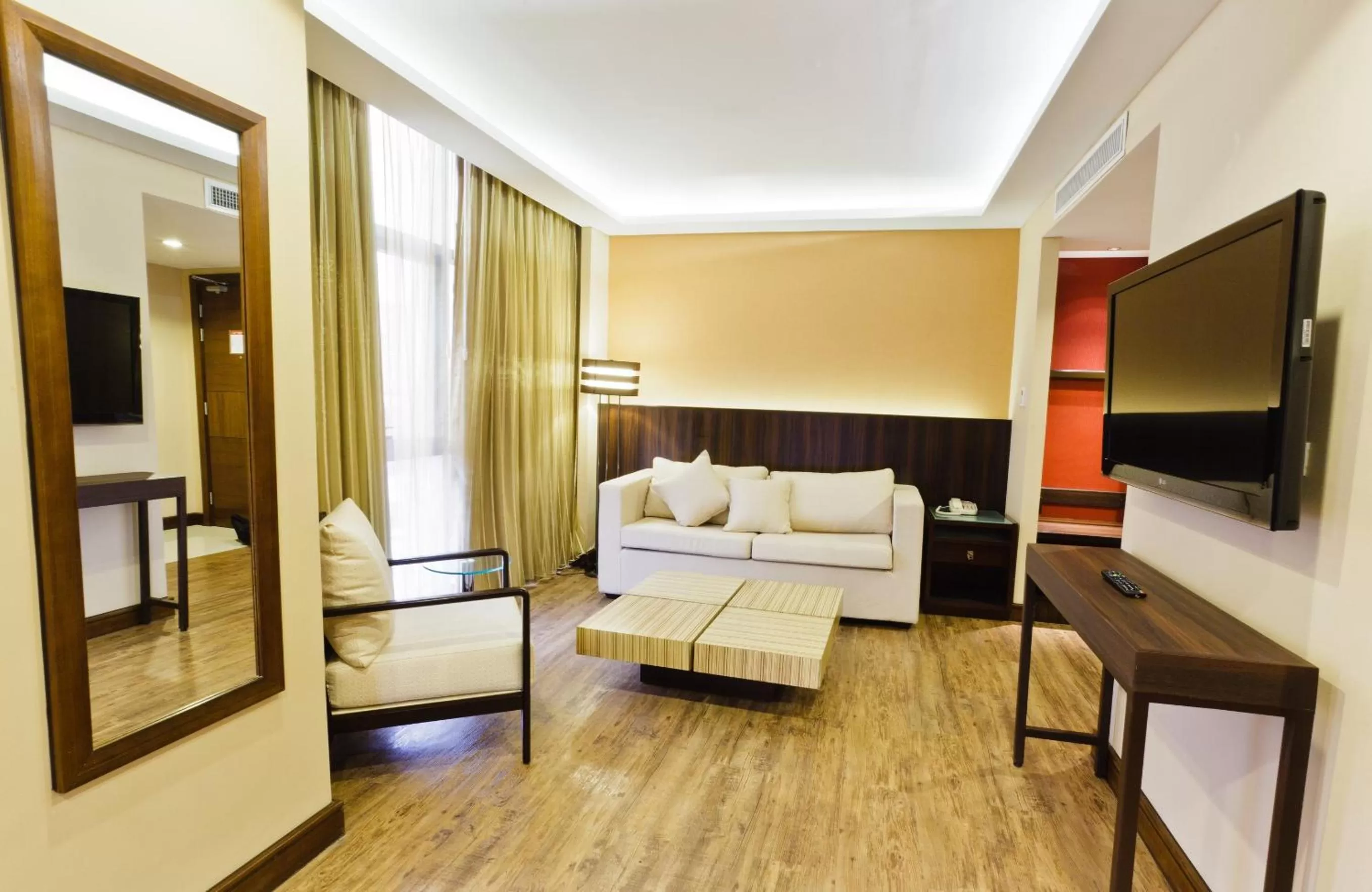 Living room, Bed in Ramada by Wyndham Manila Central